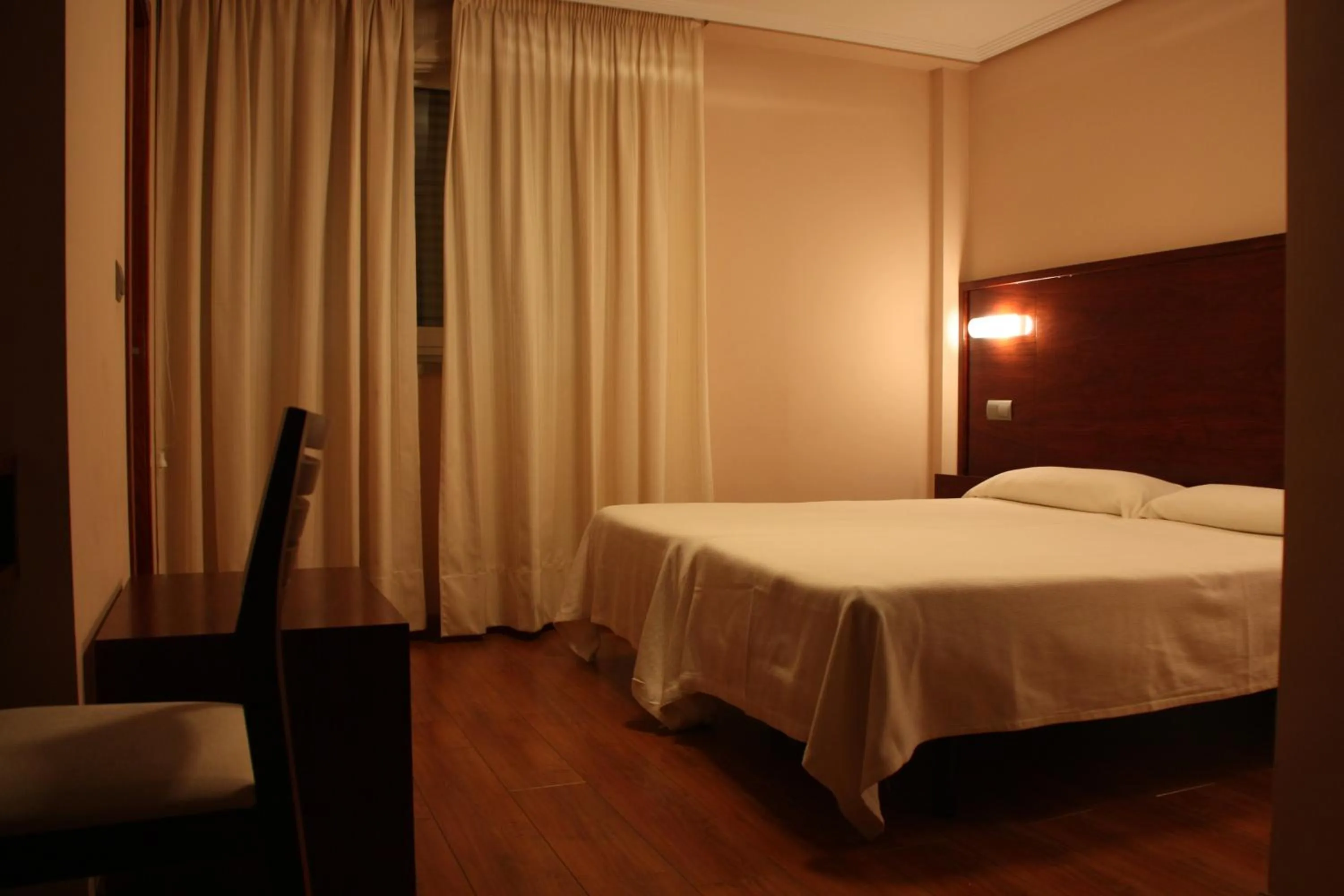 Bed in Hotel Tremazal