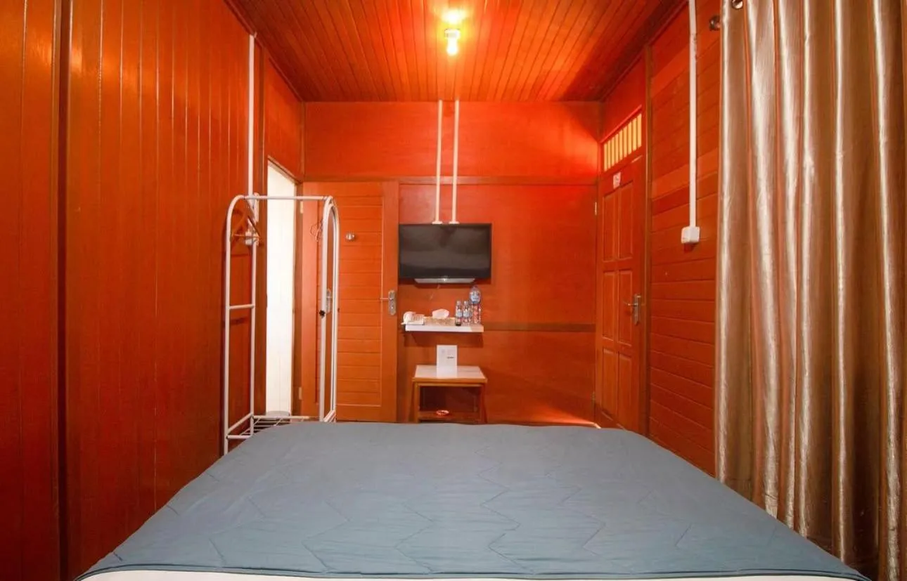 Bed in GRANADA INN PALU