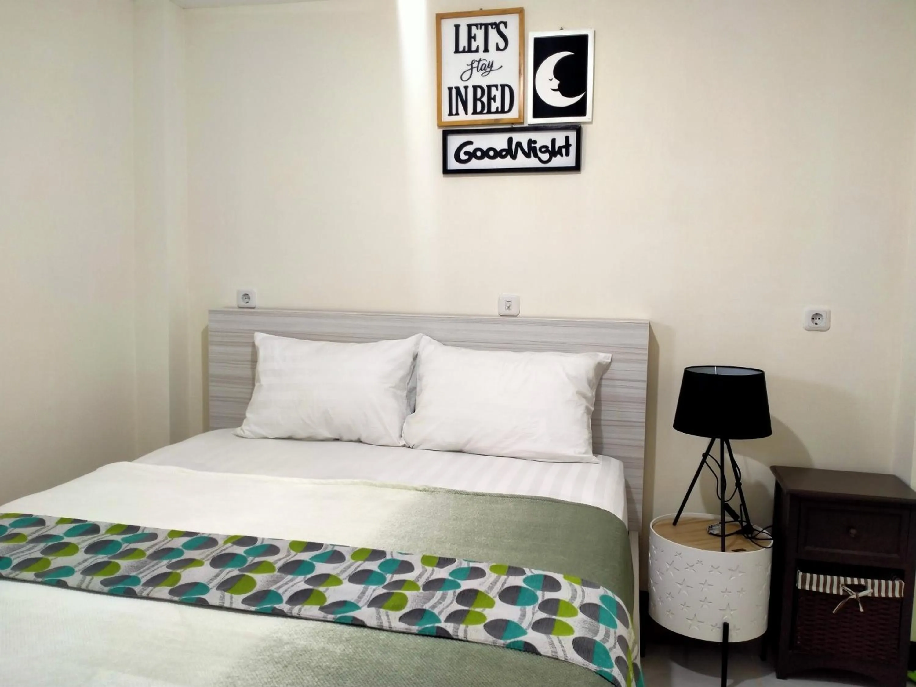 Bed in GRANADA INN PALU