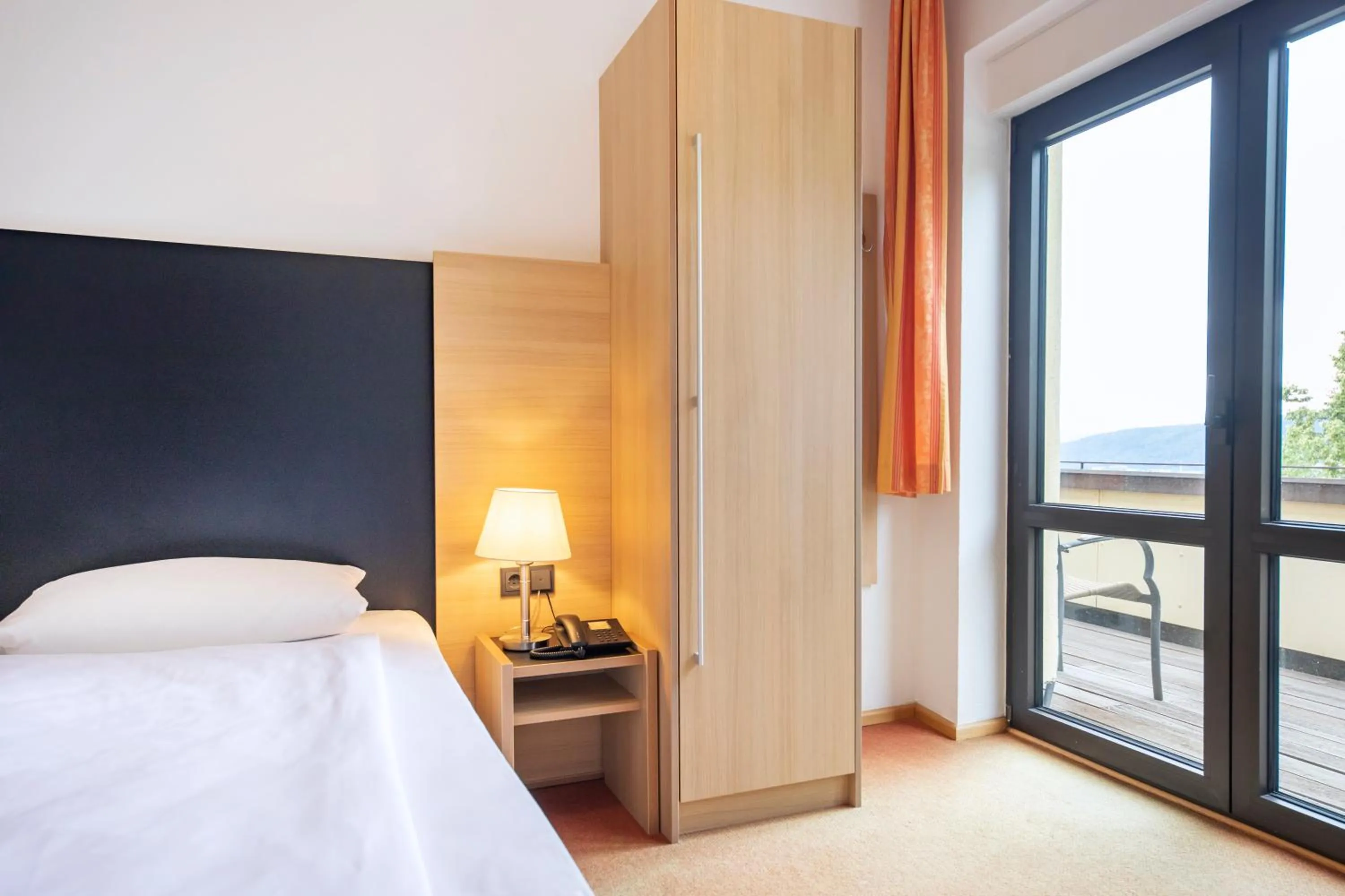 Photo of the whole room, Bed in Michel Hotel Franziskushöhe Lohr am Main