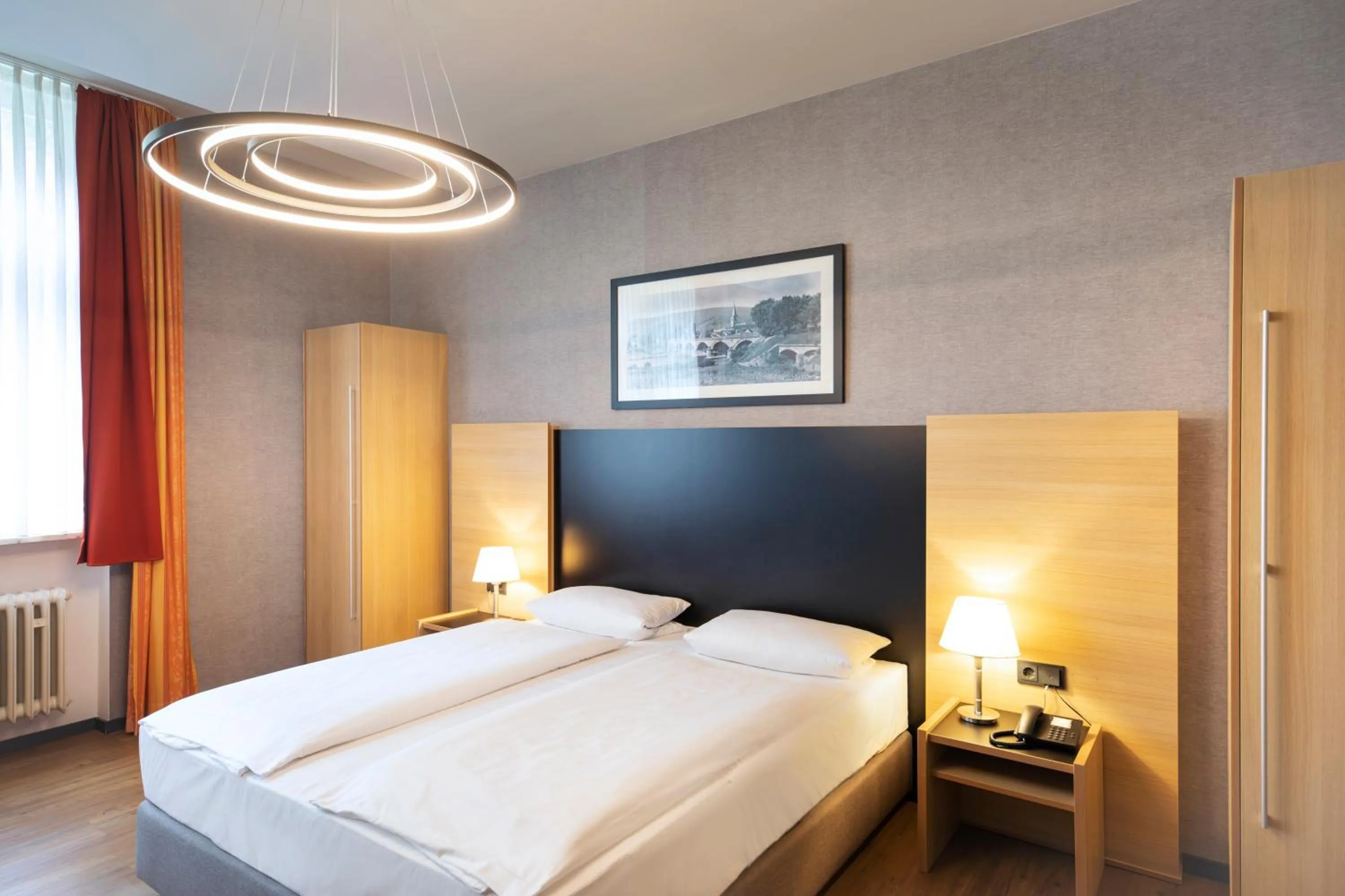 Photo of the whole room, Bed in Michel Hotel Franziskushöhe Lohr am Main