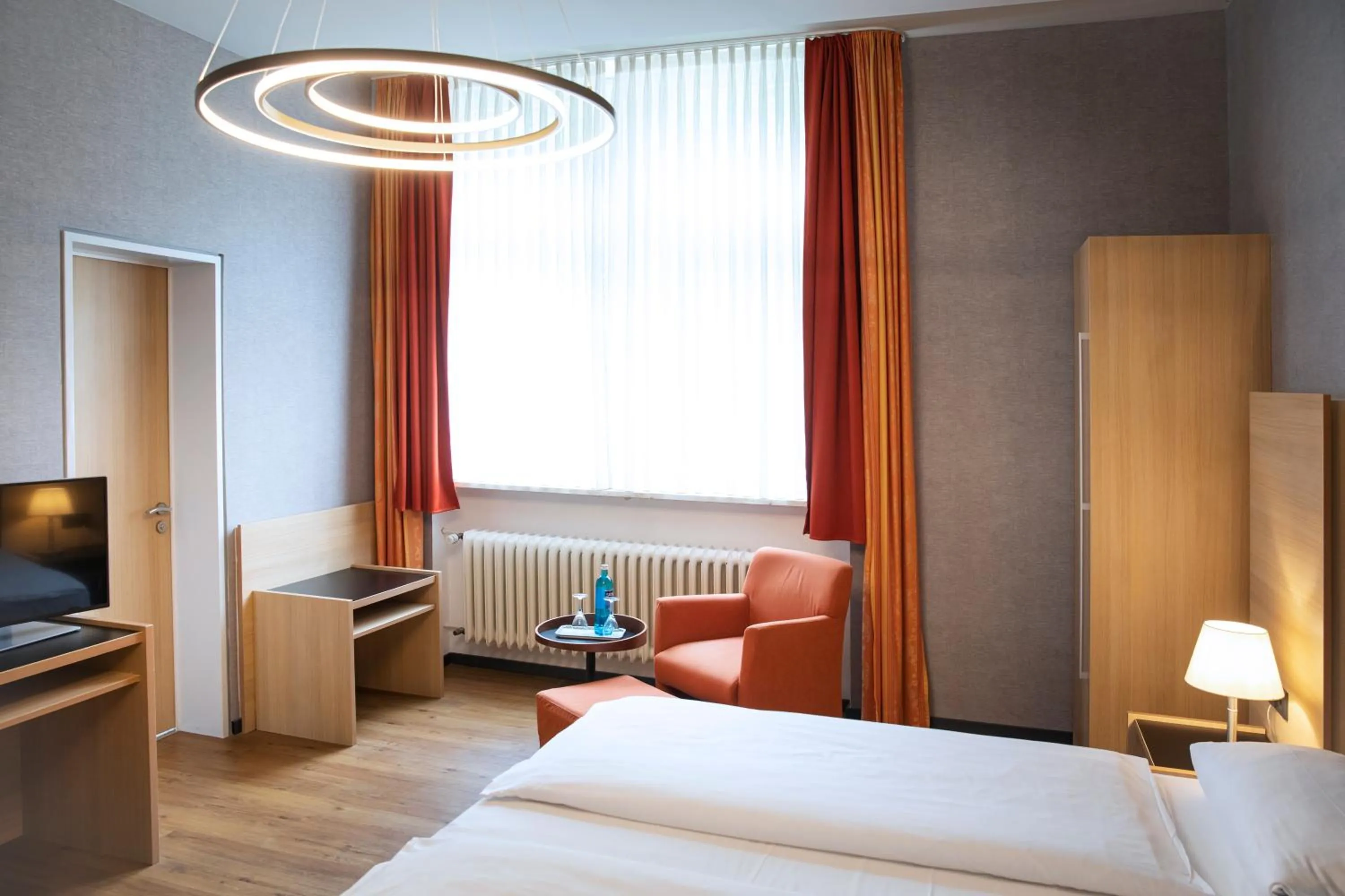 Photo of the whole room, Bed in Michel Hotel Franziskushöhe Lohr am Main