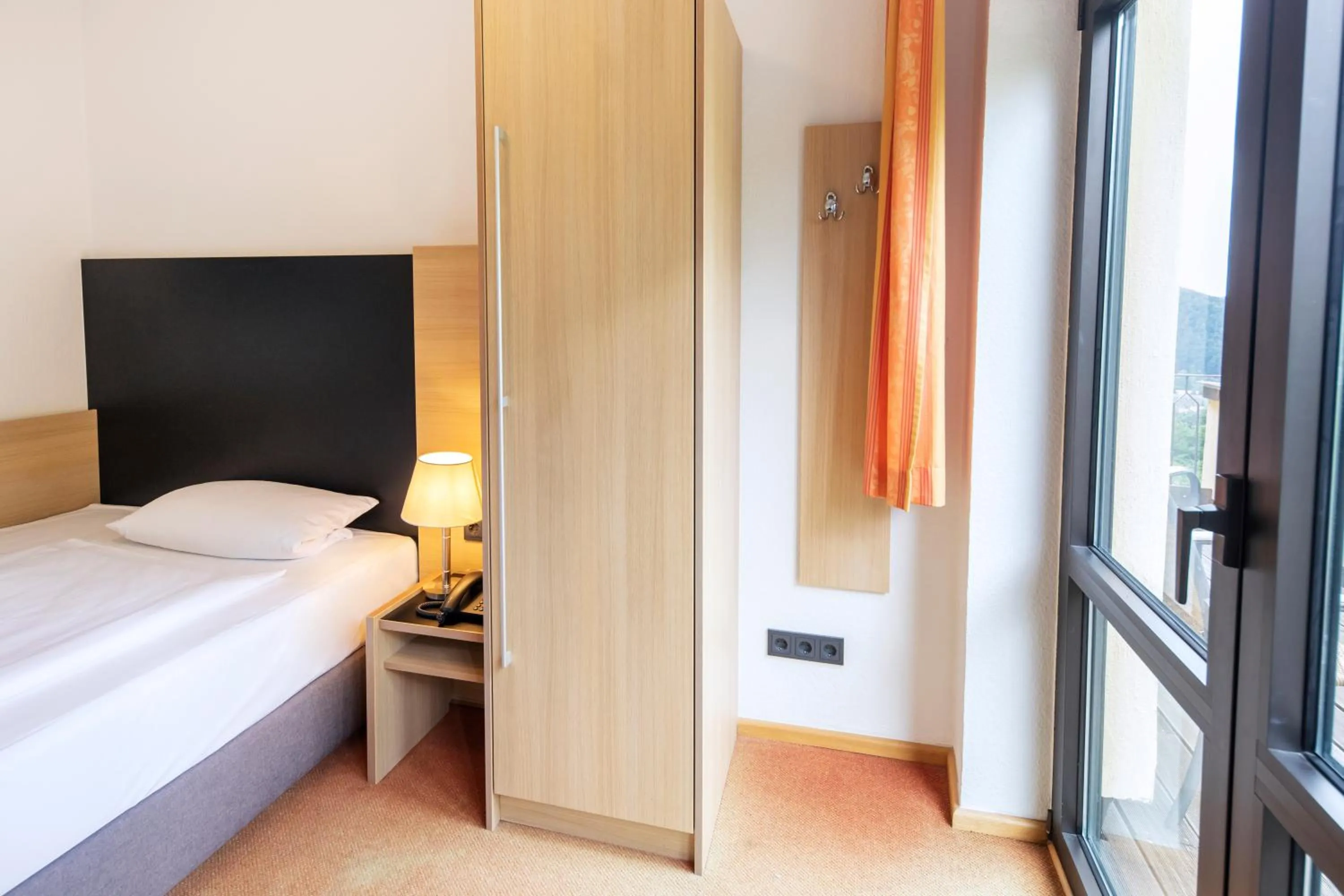 Photo of the whole room, Bed in Michel Hotel Franziskushöhe Lohr am Main