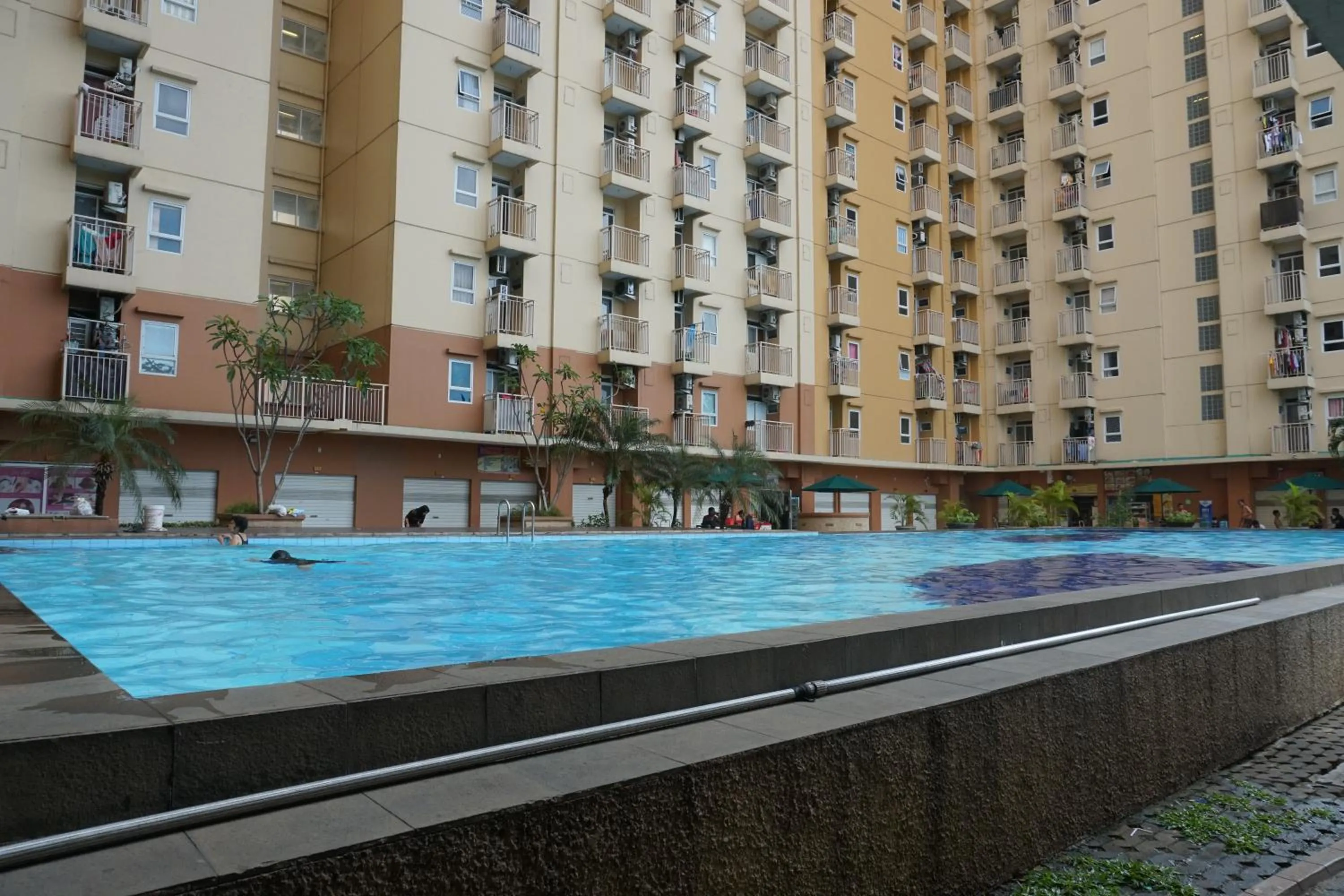 Property building in Comfortable 3BR Apartment at Green Palm Residences By Travelio