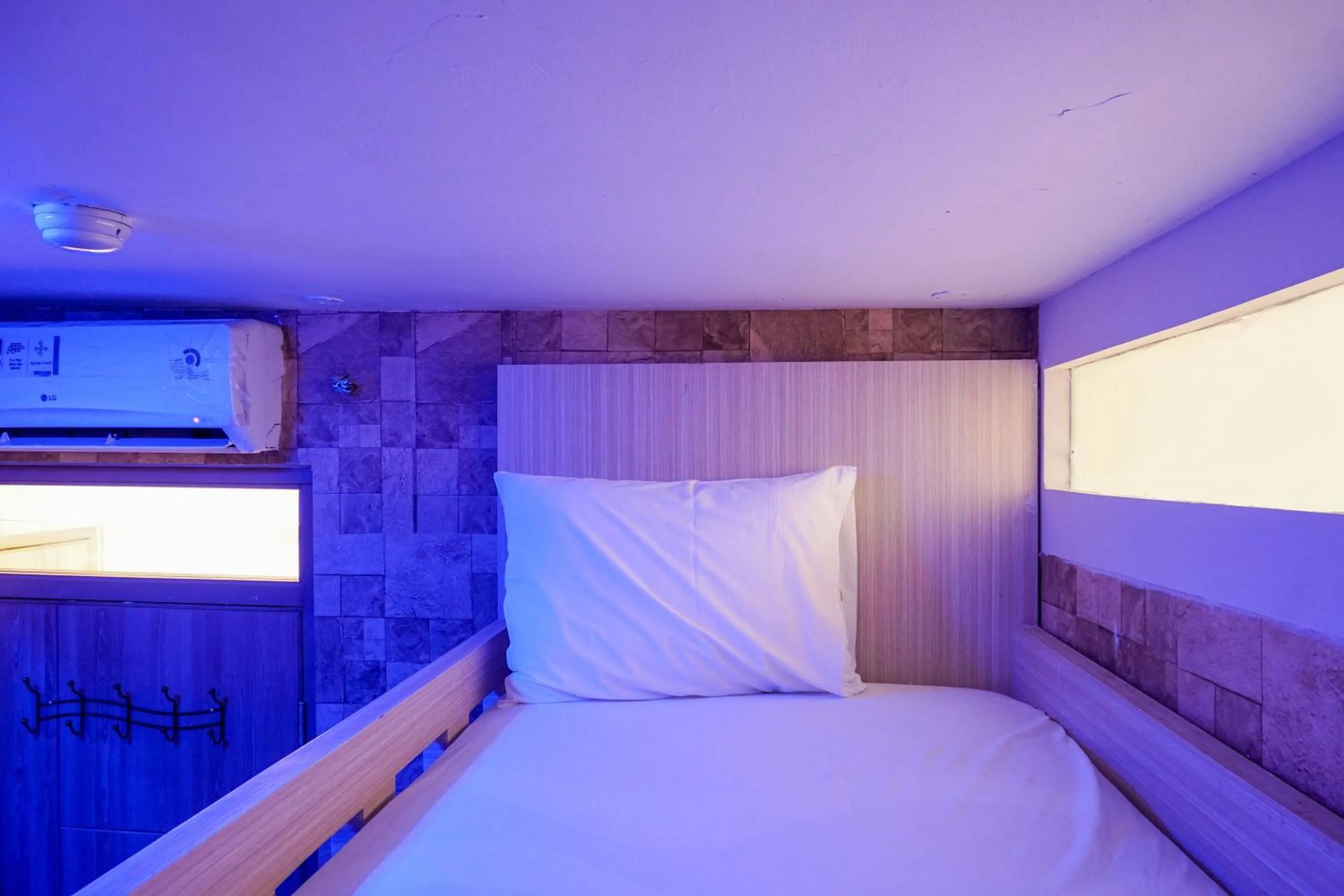 Bed in Comfortable 3BR Apartment at Green Palm Residences By Travelio