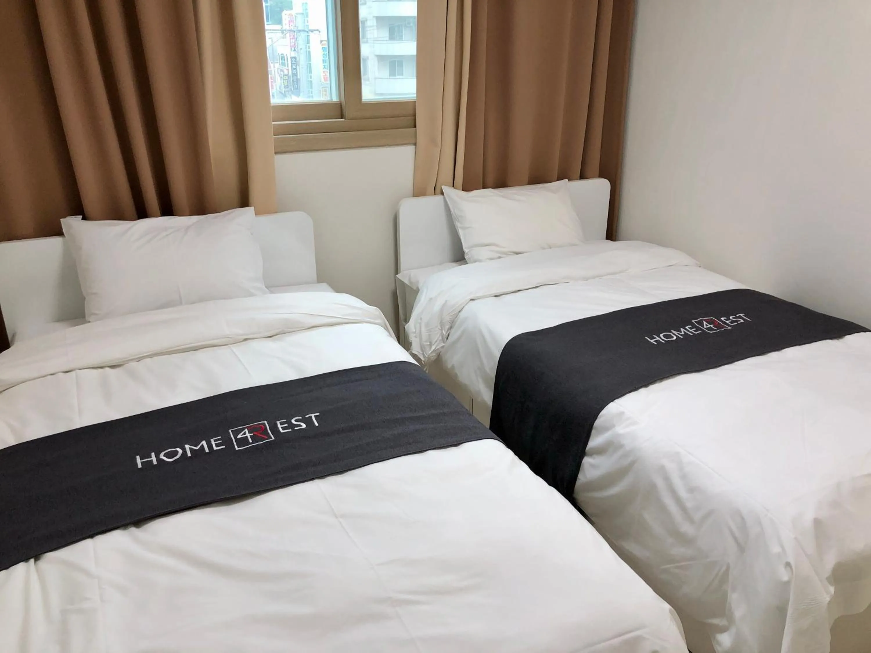 Bed in JS Residence Hotel Okpo