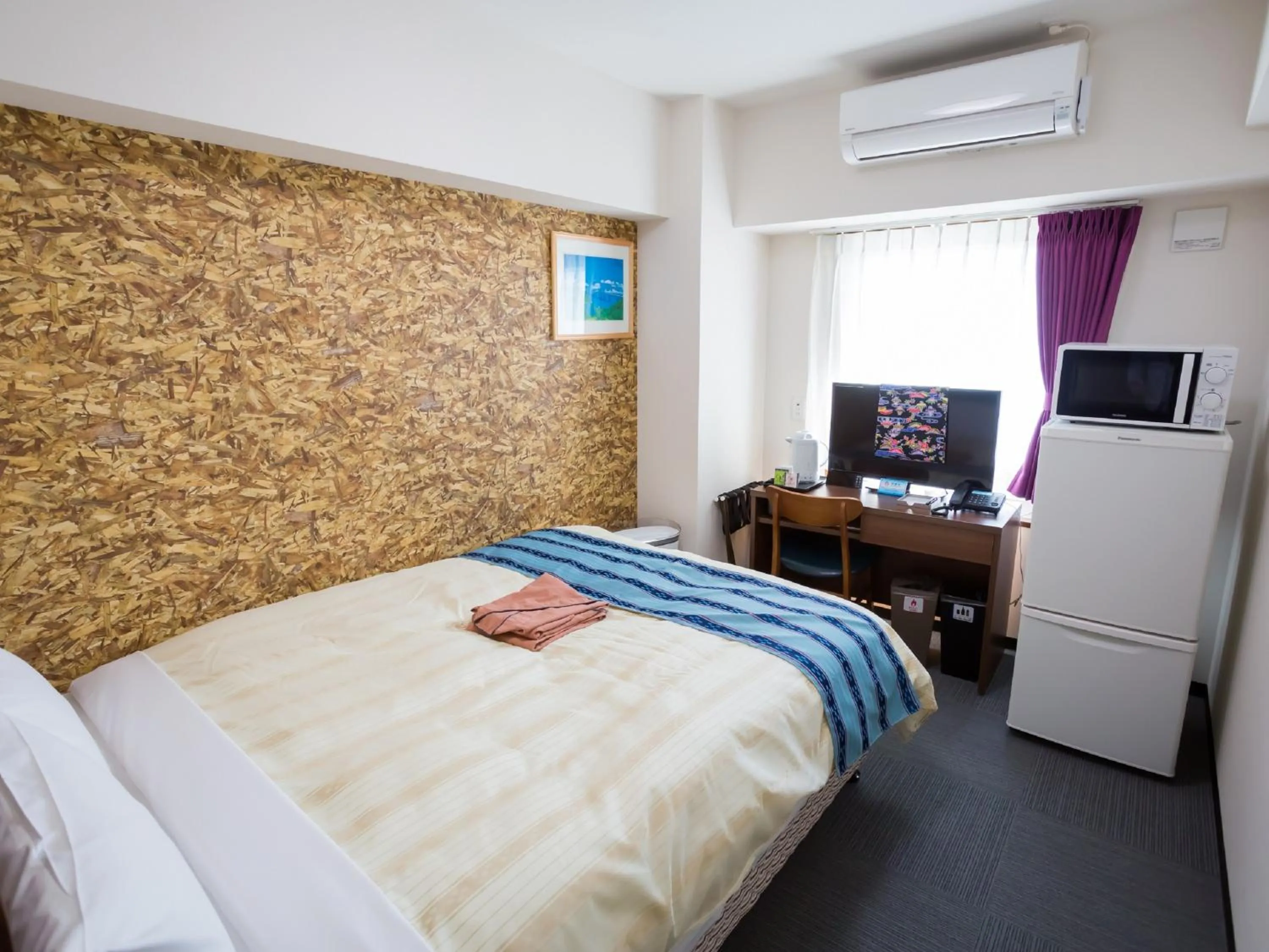 Bed in Hotel Peace Island Nago