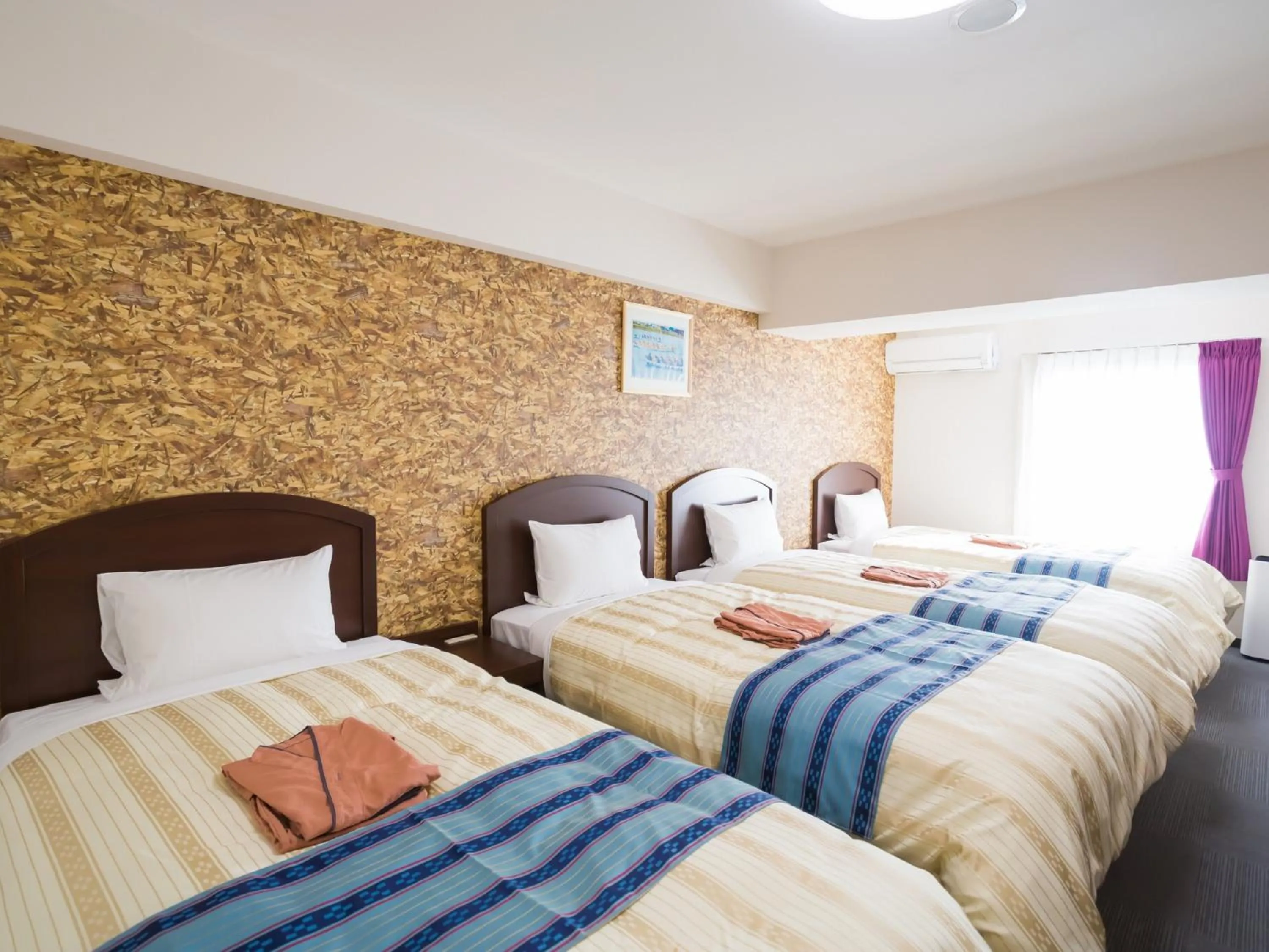 Bed in Hotel Peace Island Nago