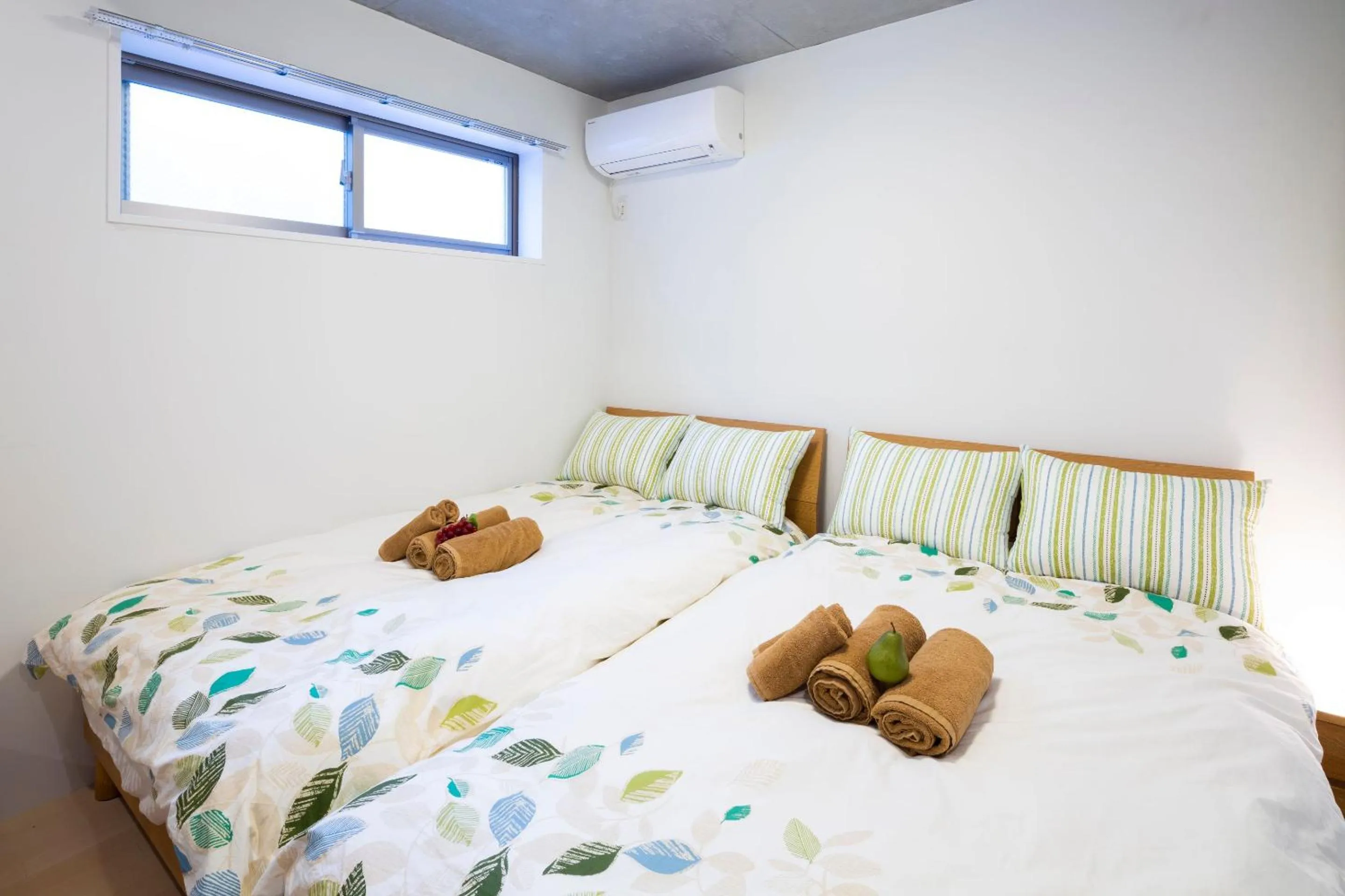 Bed in Laffitte Hirai Condominium Hotel