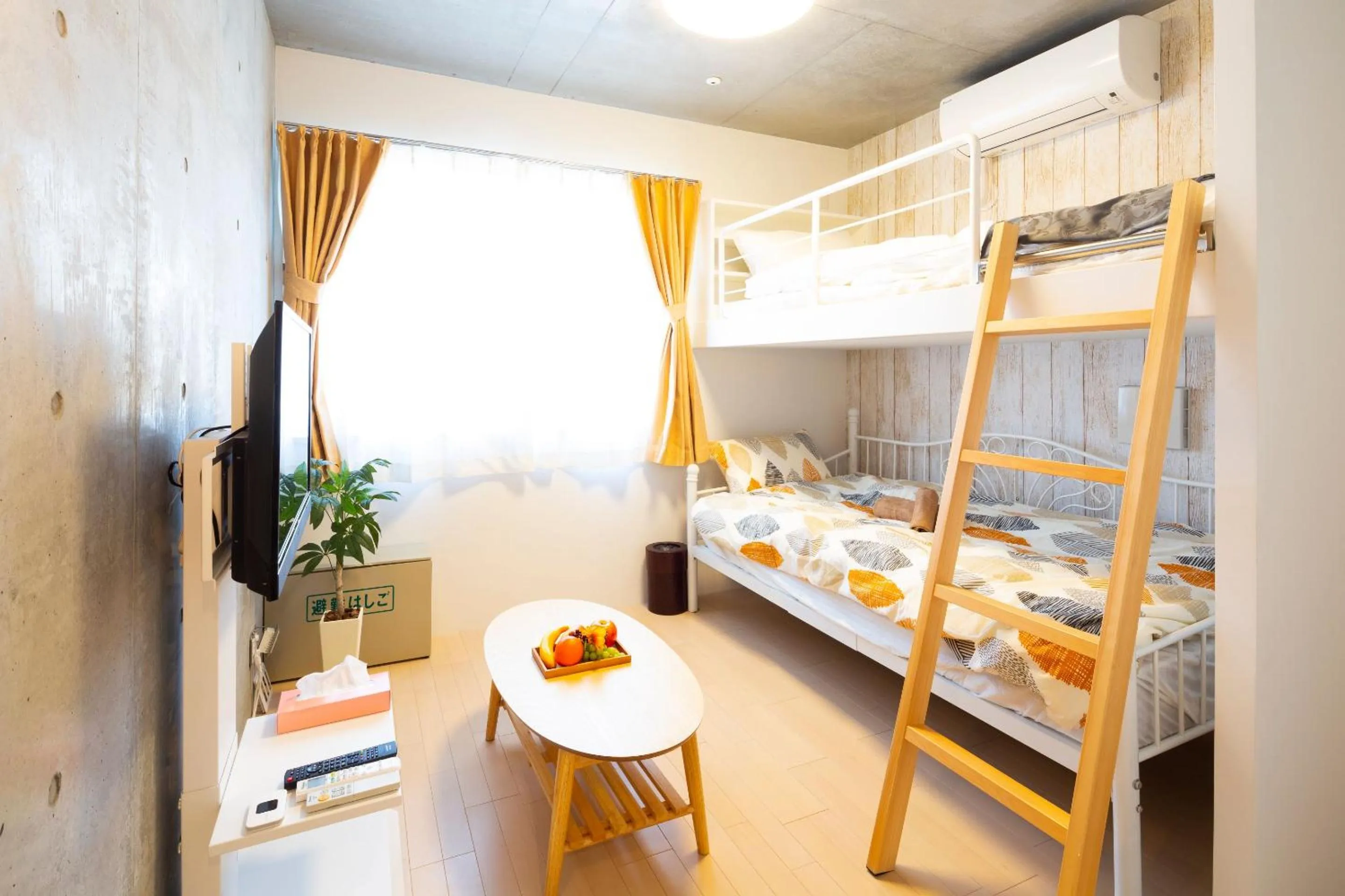 Bed in Laffitte Hirai Condominium Hotel