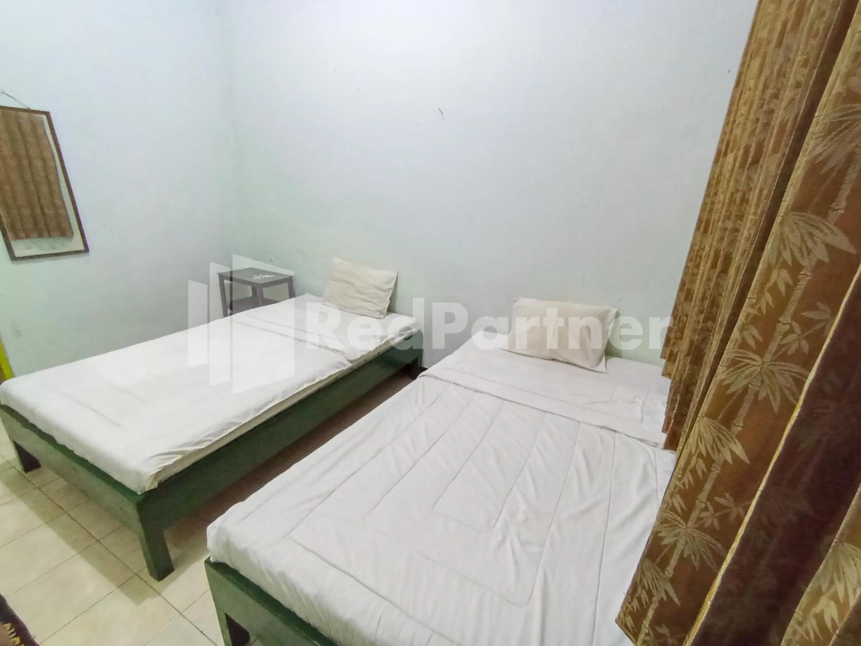 Bedroom, Bed in Orange inn RedPartner Madiun