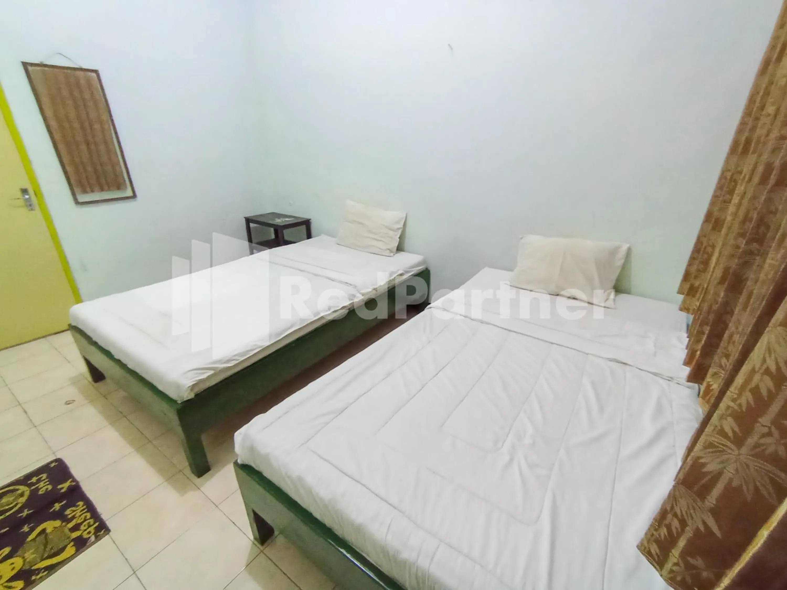 Bedroom, Bed in Orange inn RedPartner Madiun