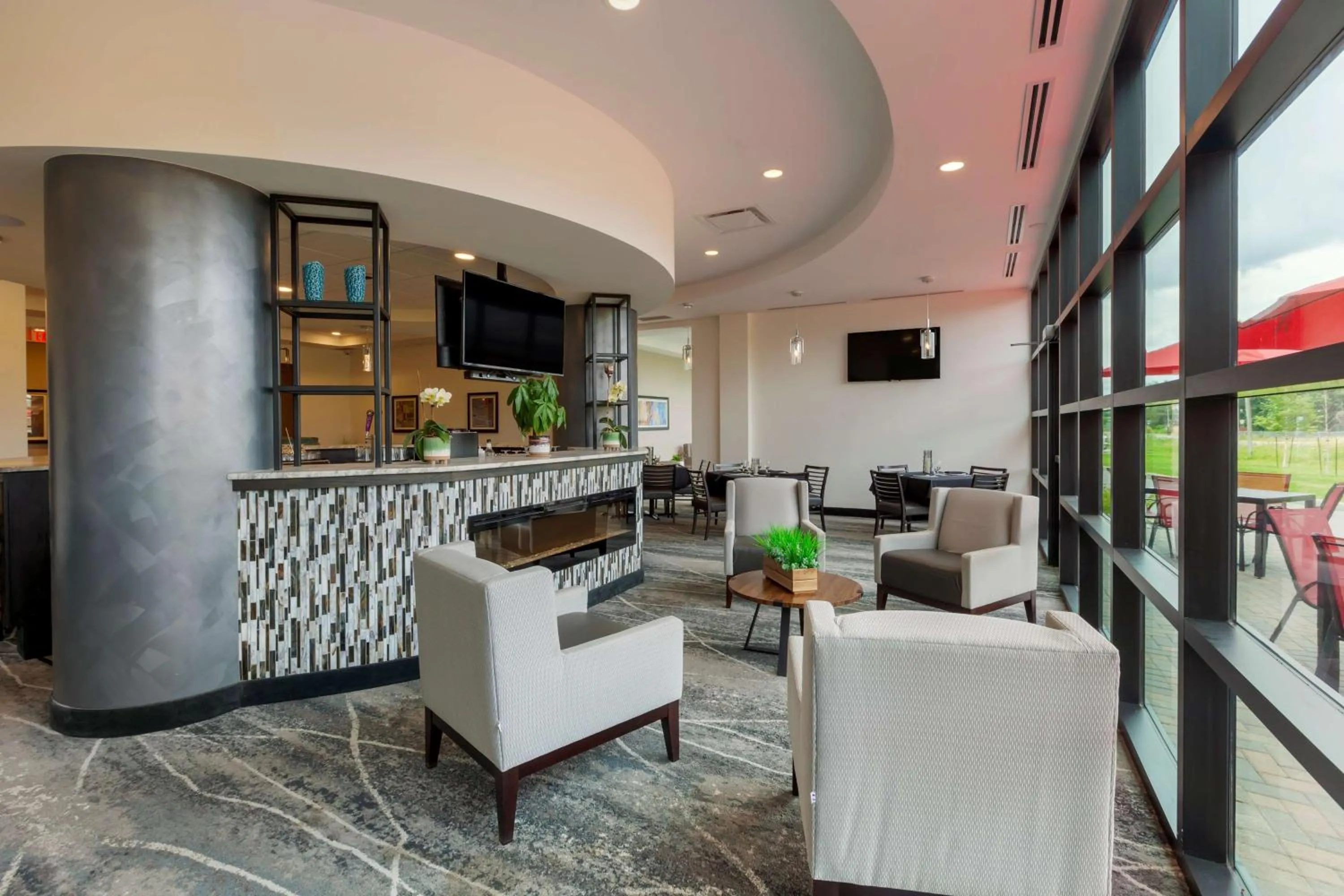 Communal lounge/ TV room in Best Western Premier Northwood Hotel