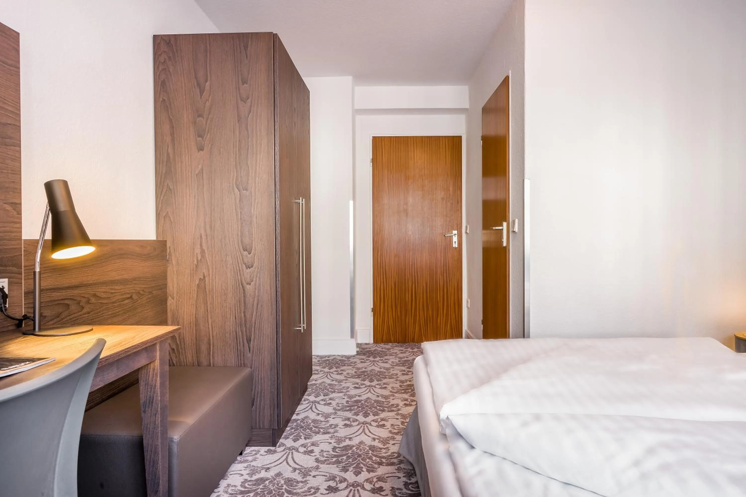 Photo of the whole room, Bed in Signature Hotel Astoria