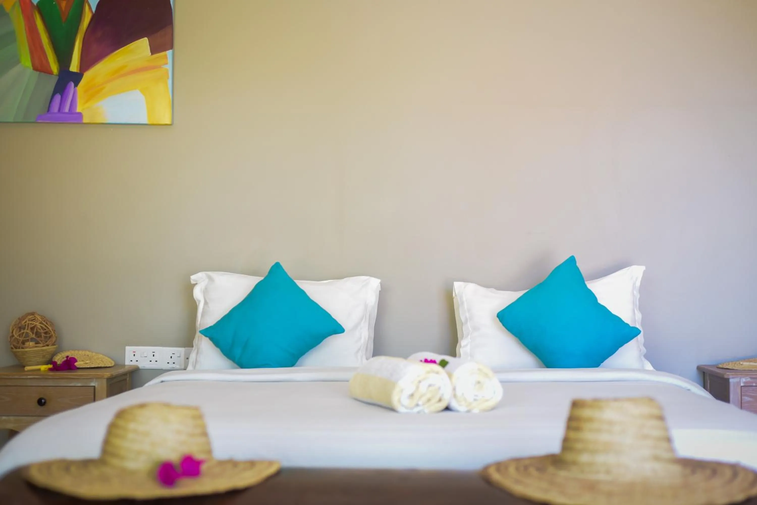 Bed in Aquamarina Hotel