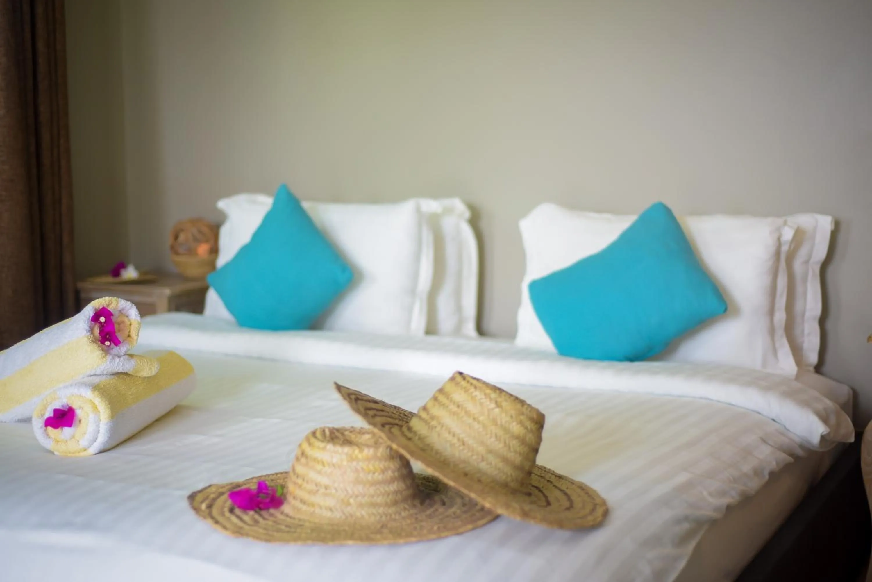 Bed in Aquamarina Hotel