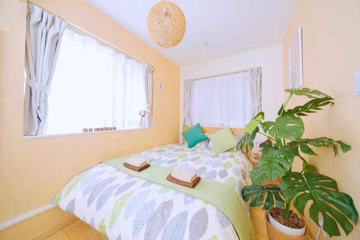 Bed in nestay villa tokyo otsuka
