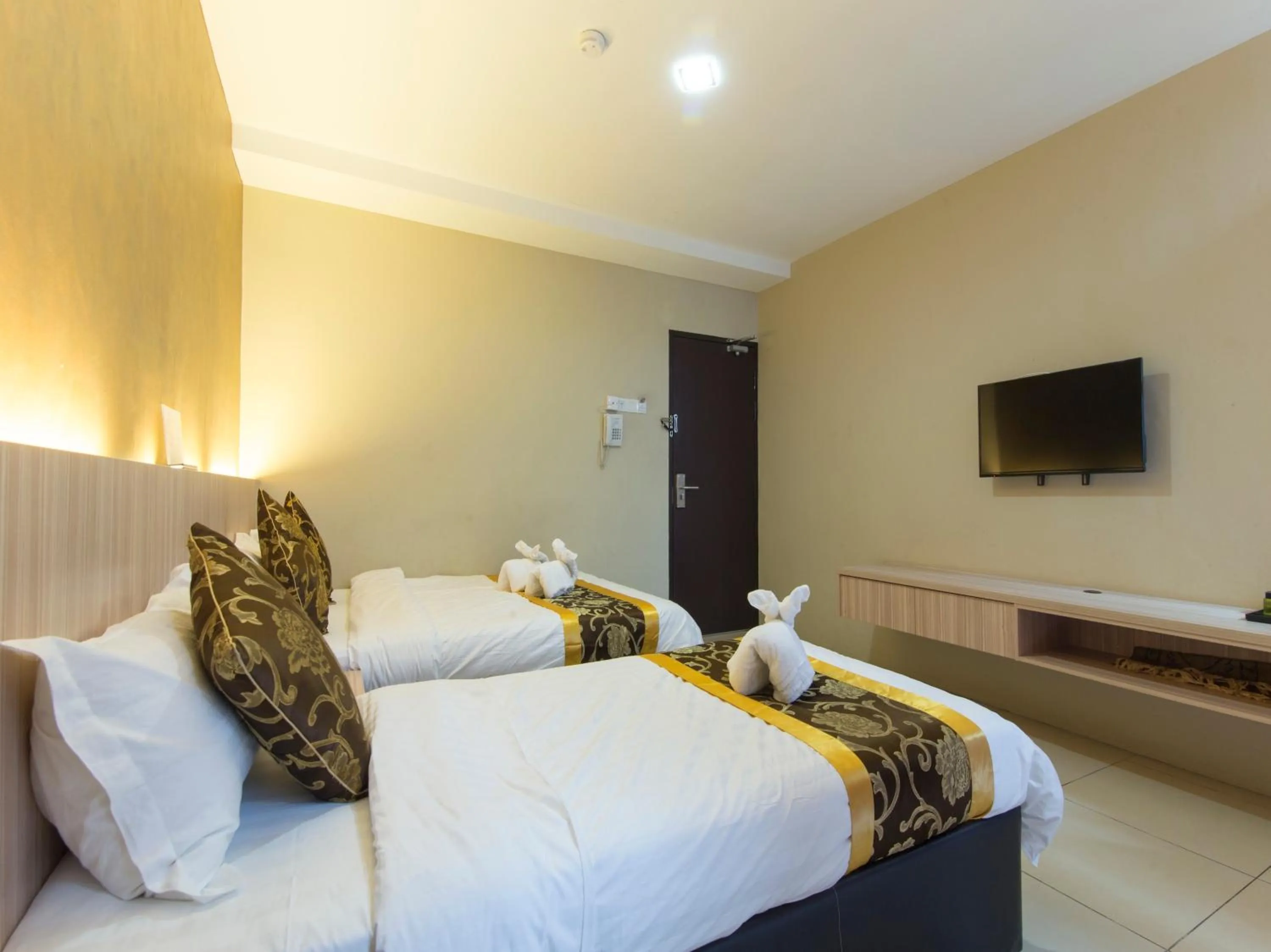 Bed in Top Garden Hotel