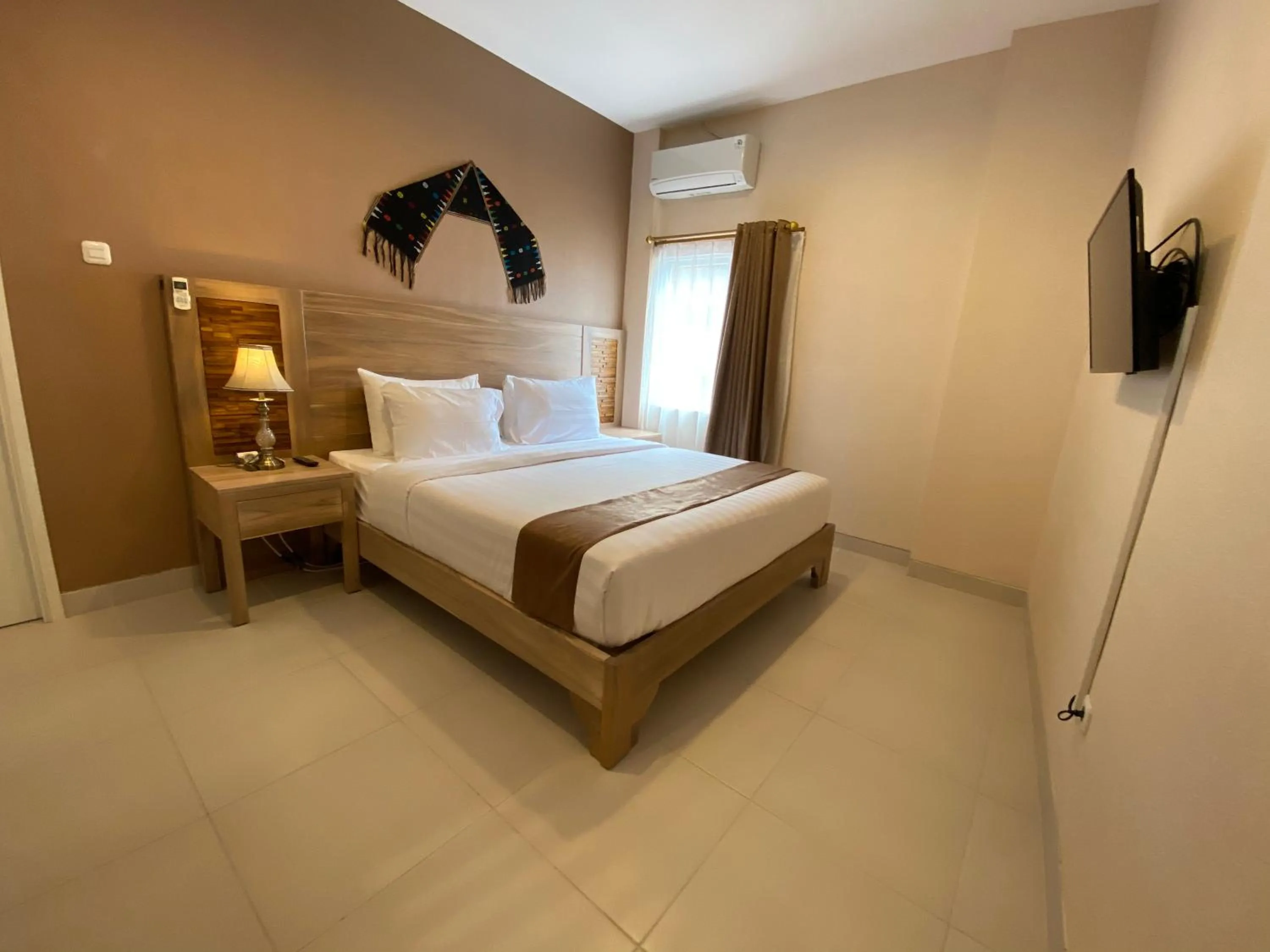 Bed in Flamingo Avia Labuan Bajo