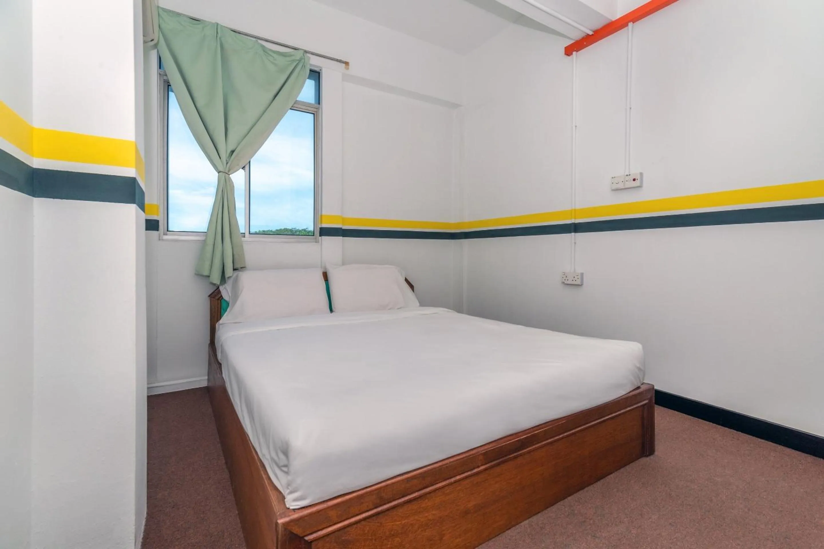 Bedroom in SPOT ON 89936 Sutera Inn