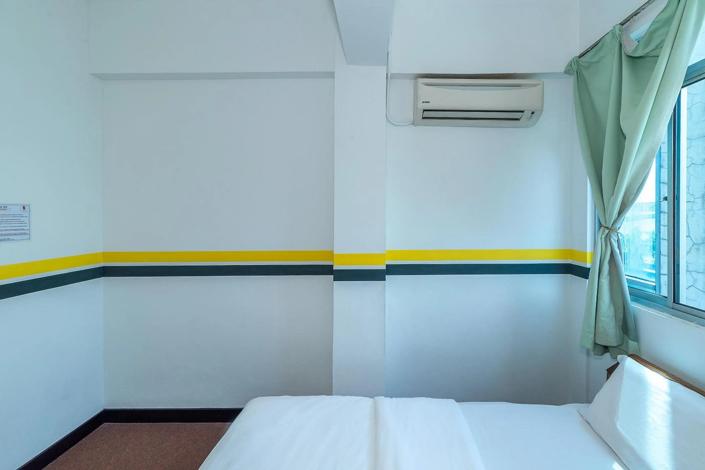 Bedroom in SPOT ON 89936 Sutera Inn