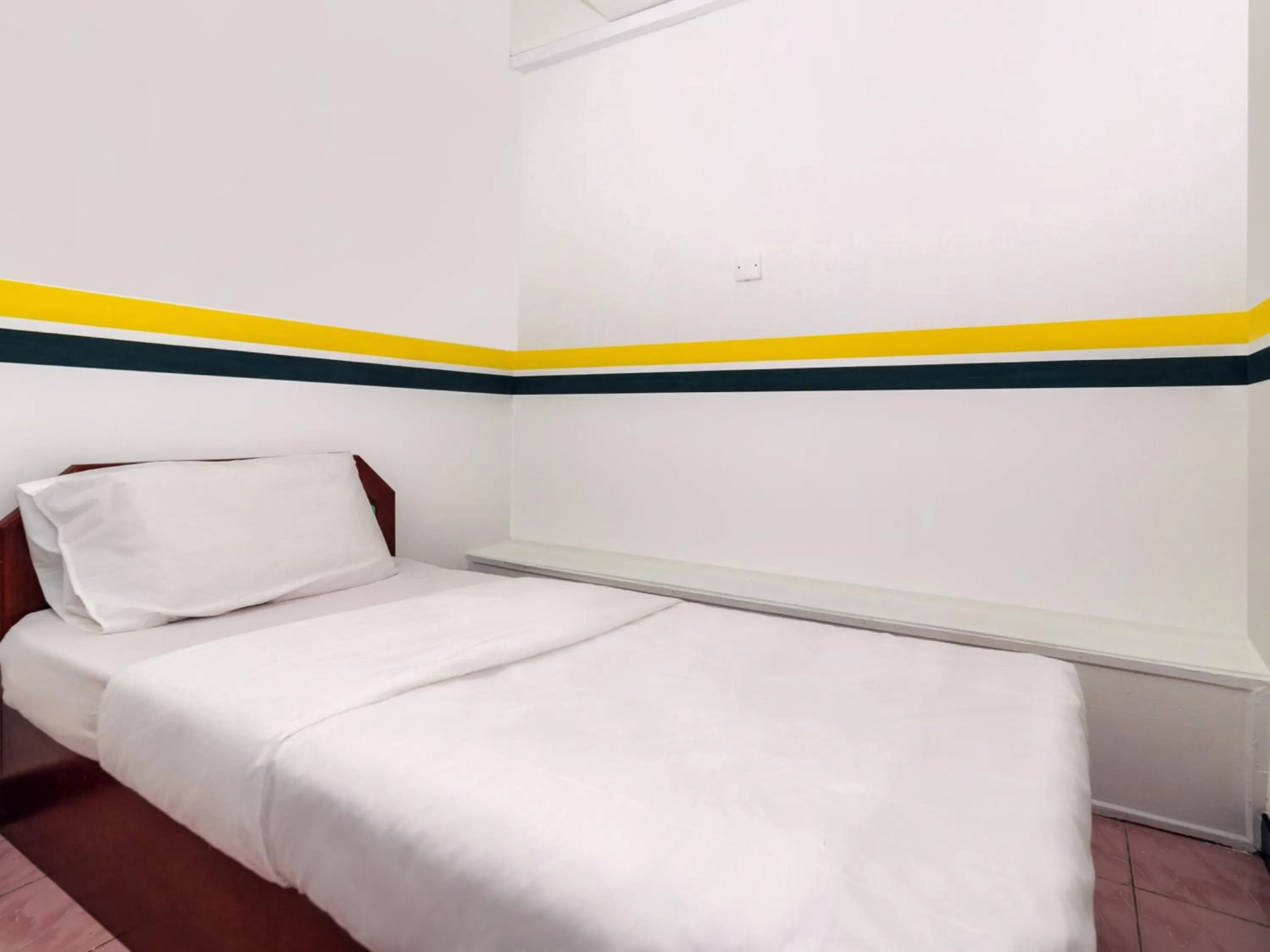 Bedroom in SPOT ON 89936 Sutera Inn