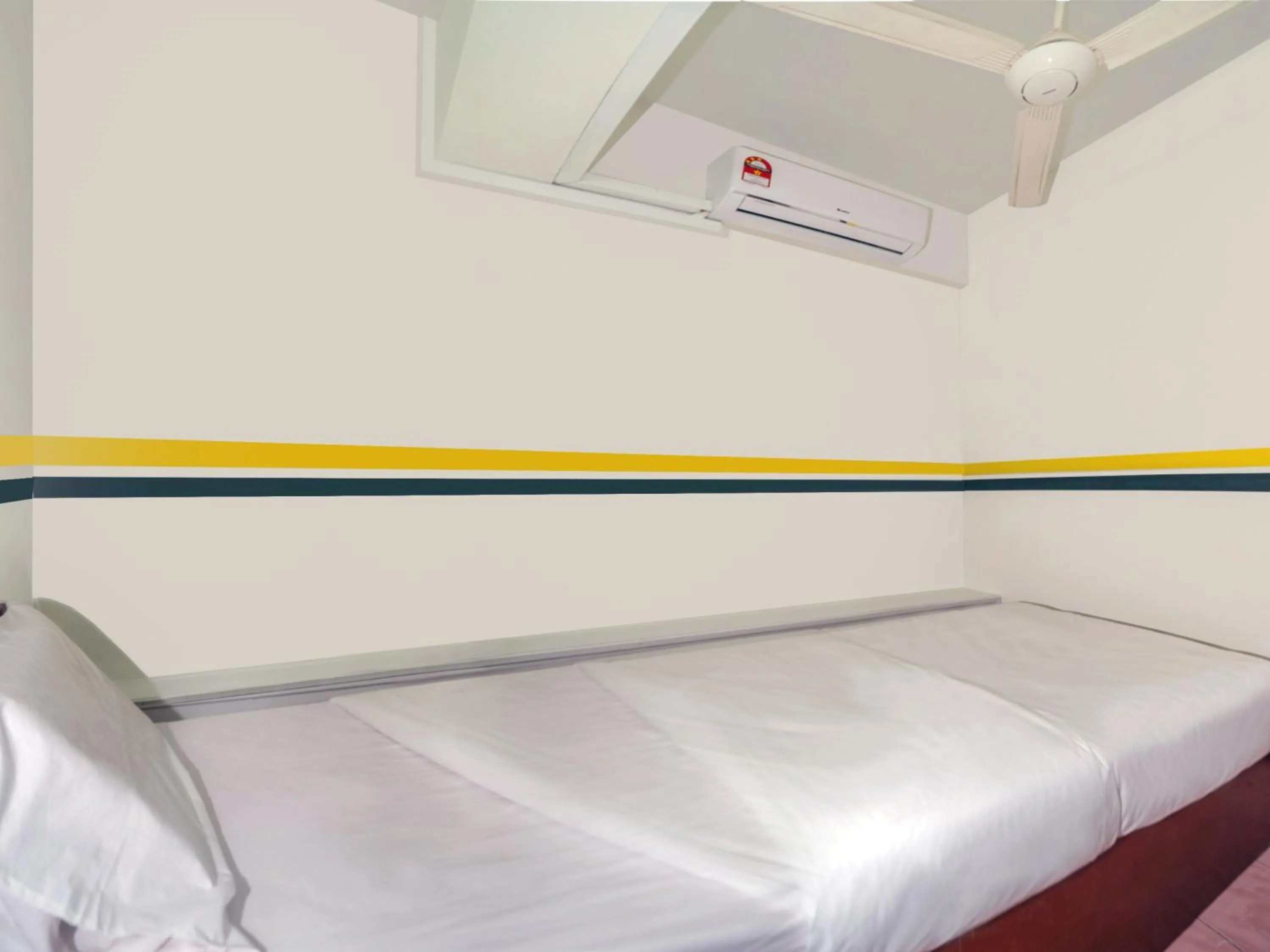 Bedroom in SPOT ON 89936 Sutera Inn