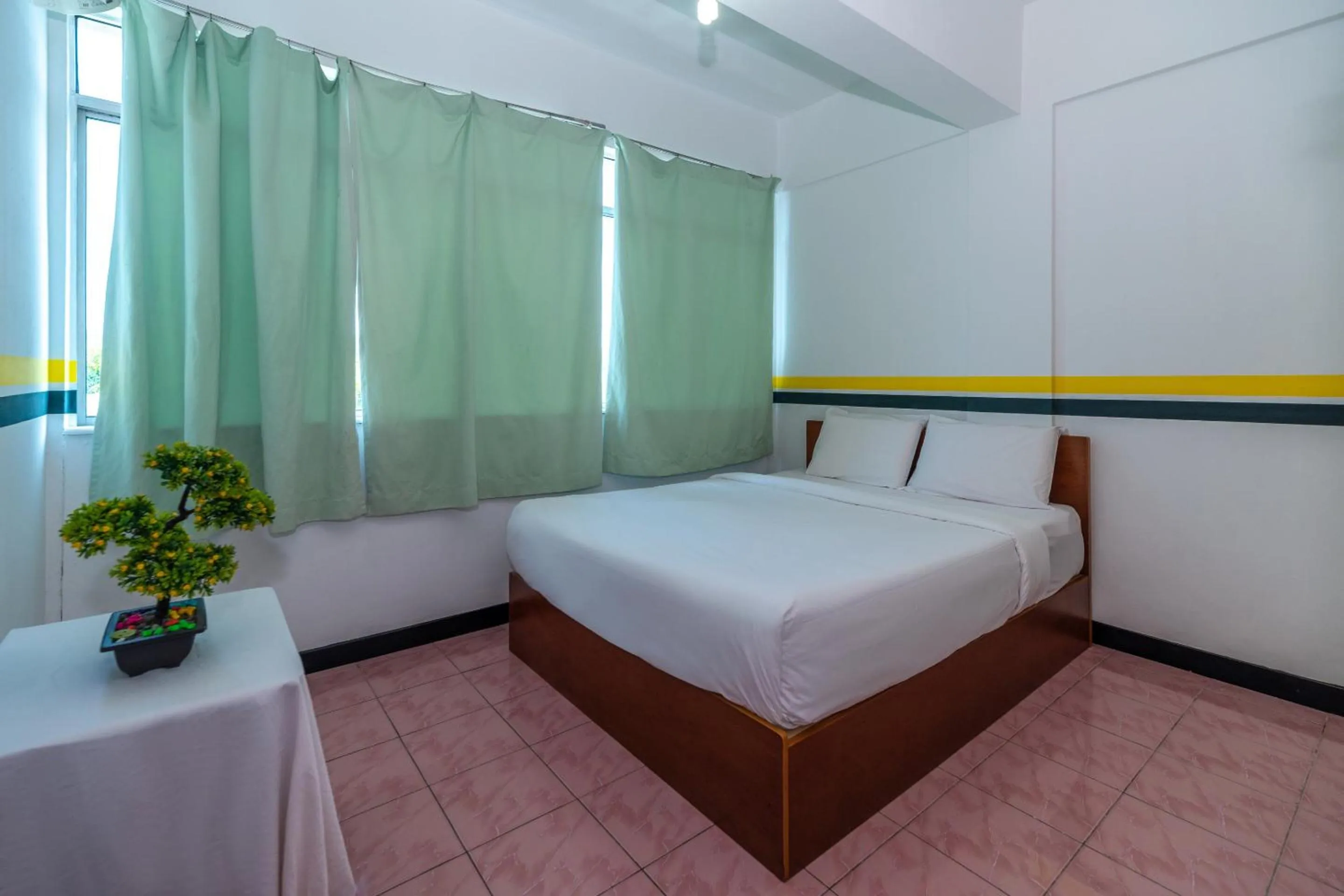 Bedroom in SPOT ON 89936 Sutera Inn