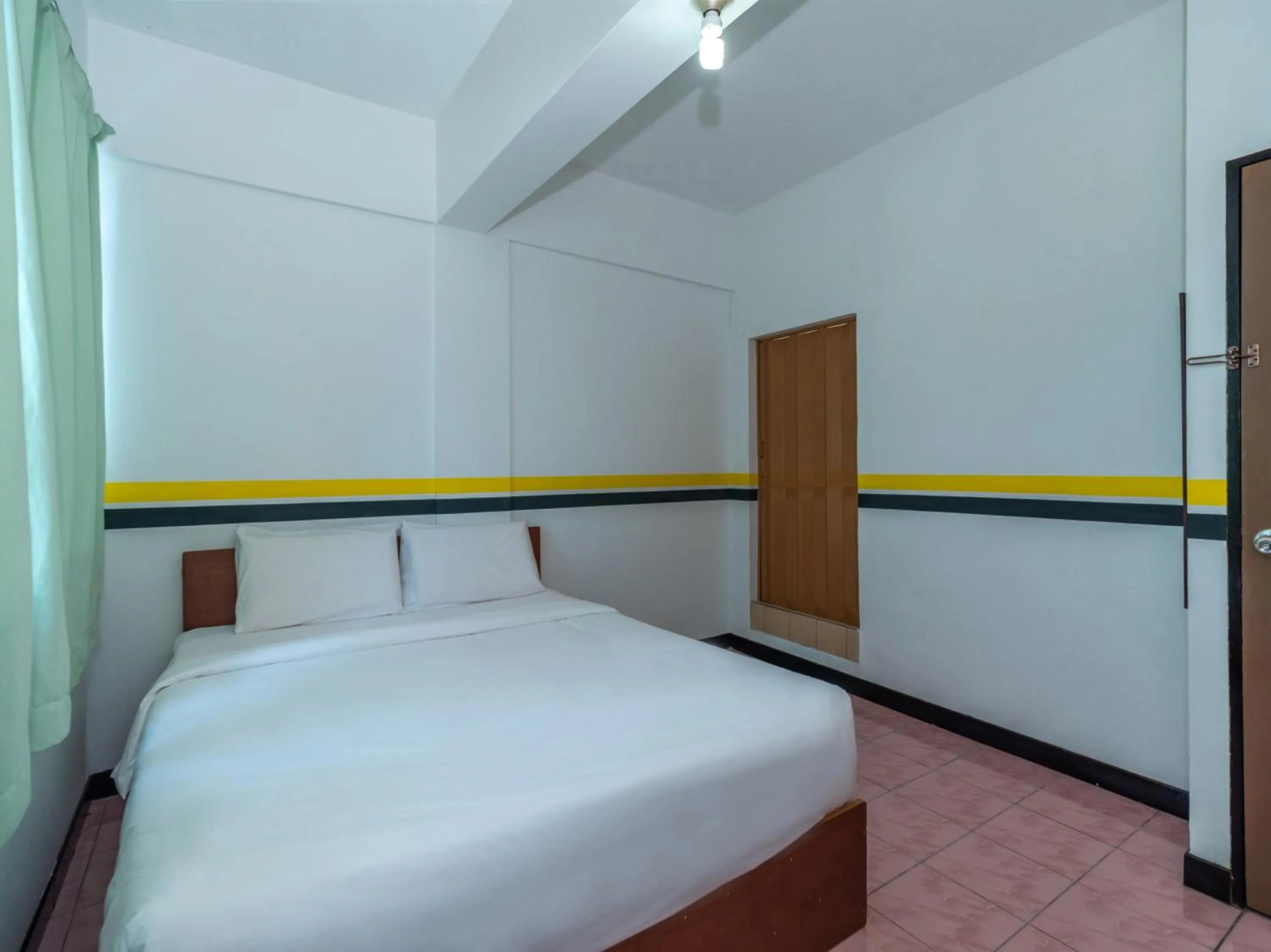 Bedroom in SPOT ON 89936 Sutera Inn