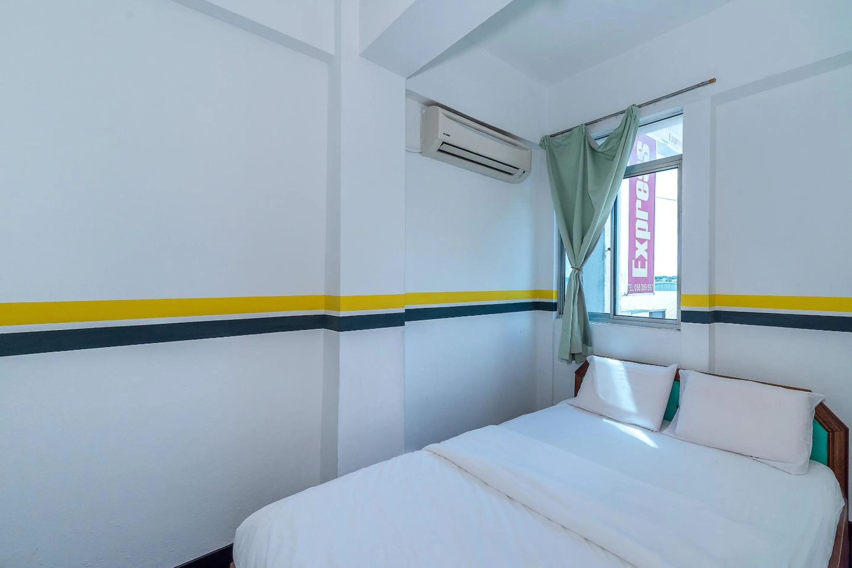 Bedroom in SPOT ON 89936 Sutera Inn