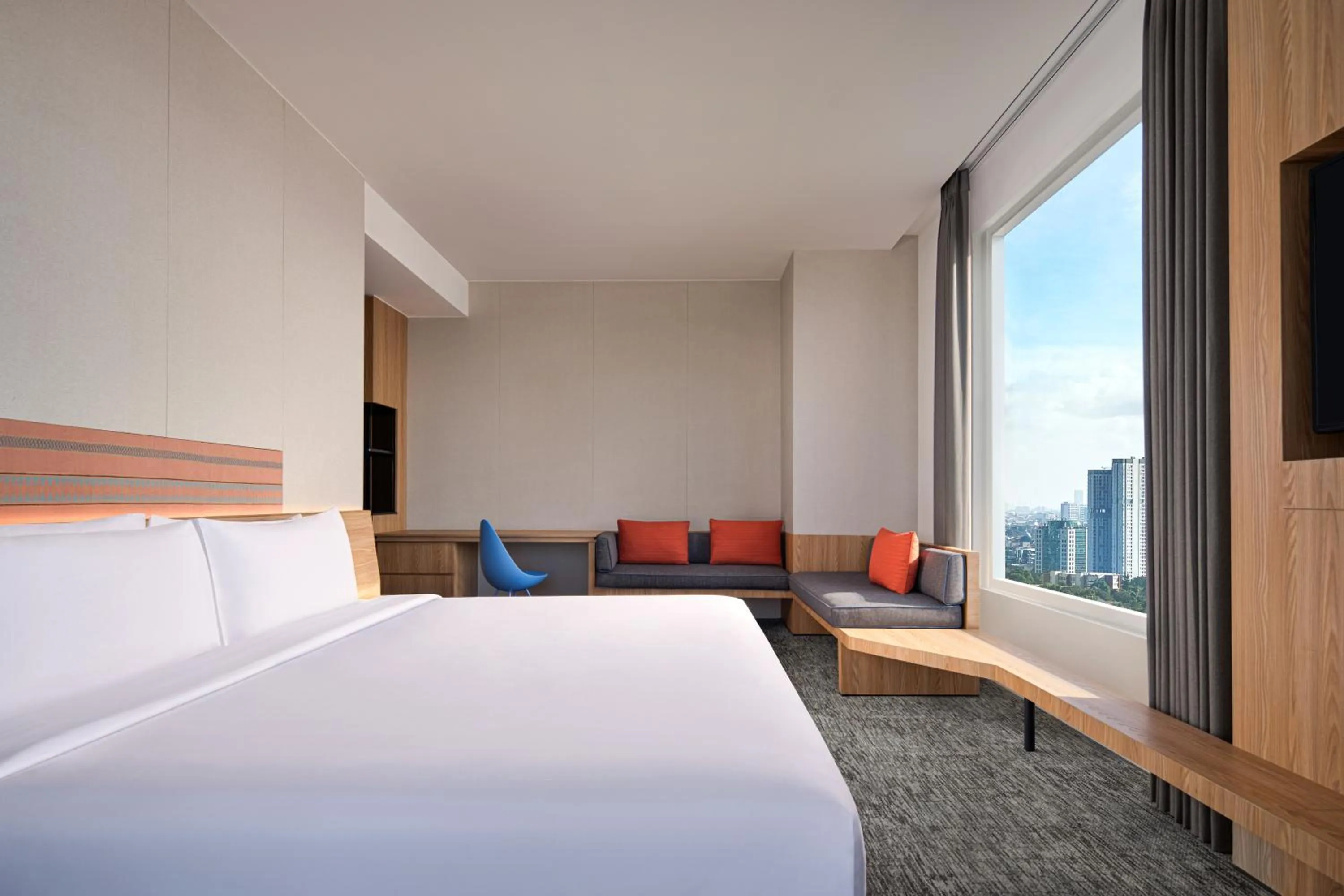 Living room, Bed in Aloft South Jakarta