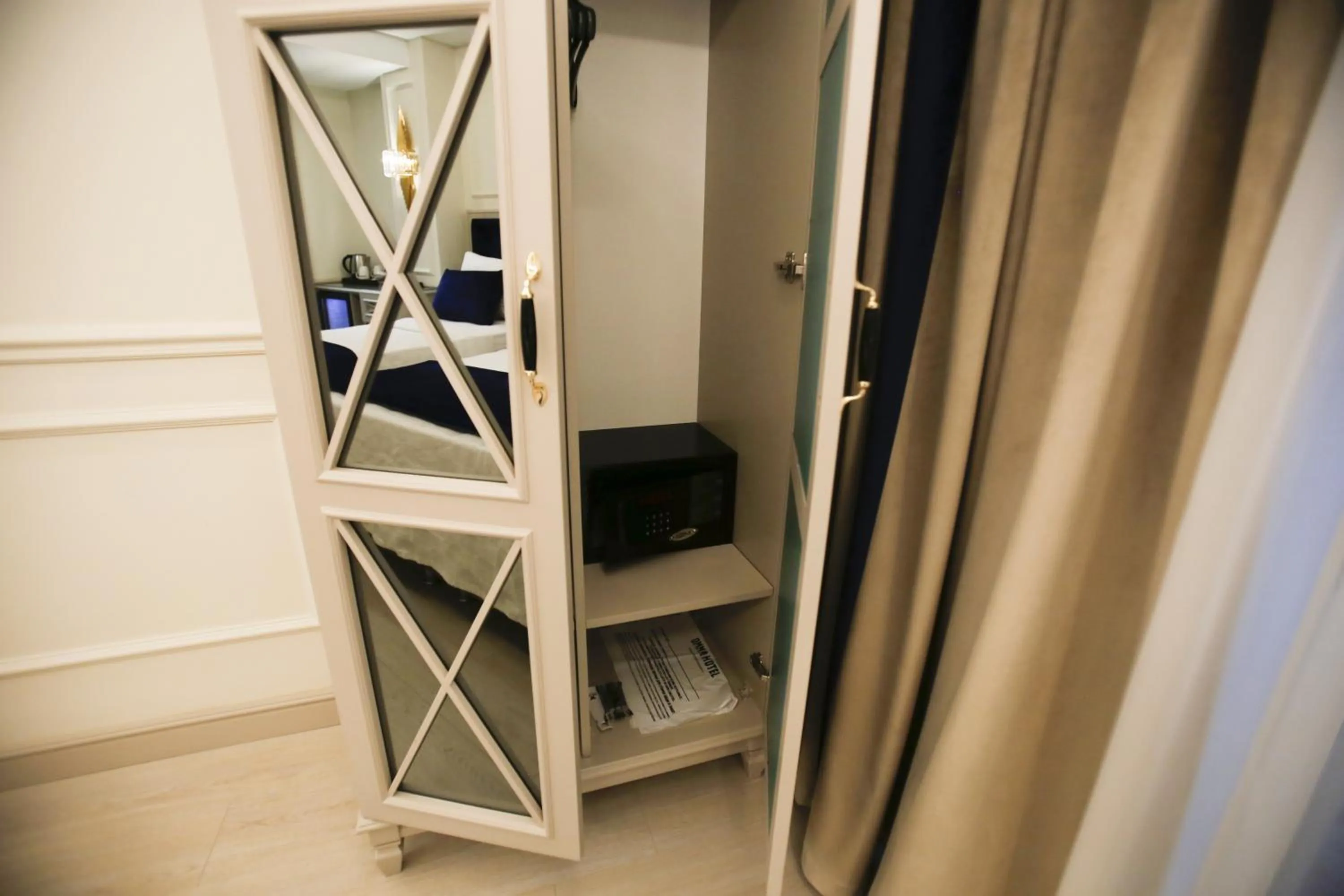 wardrobe in OMMA HOTEL