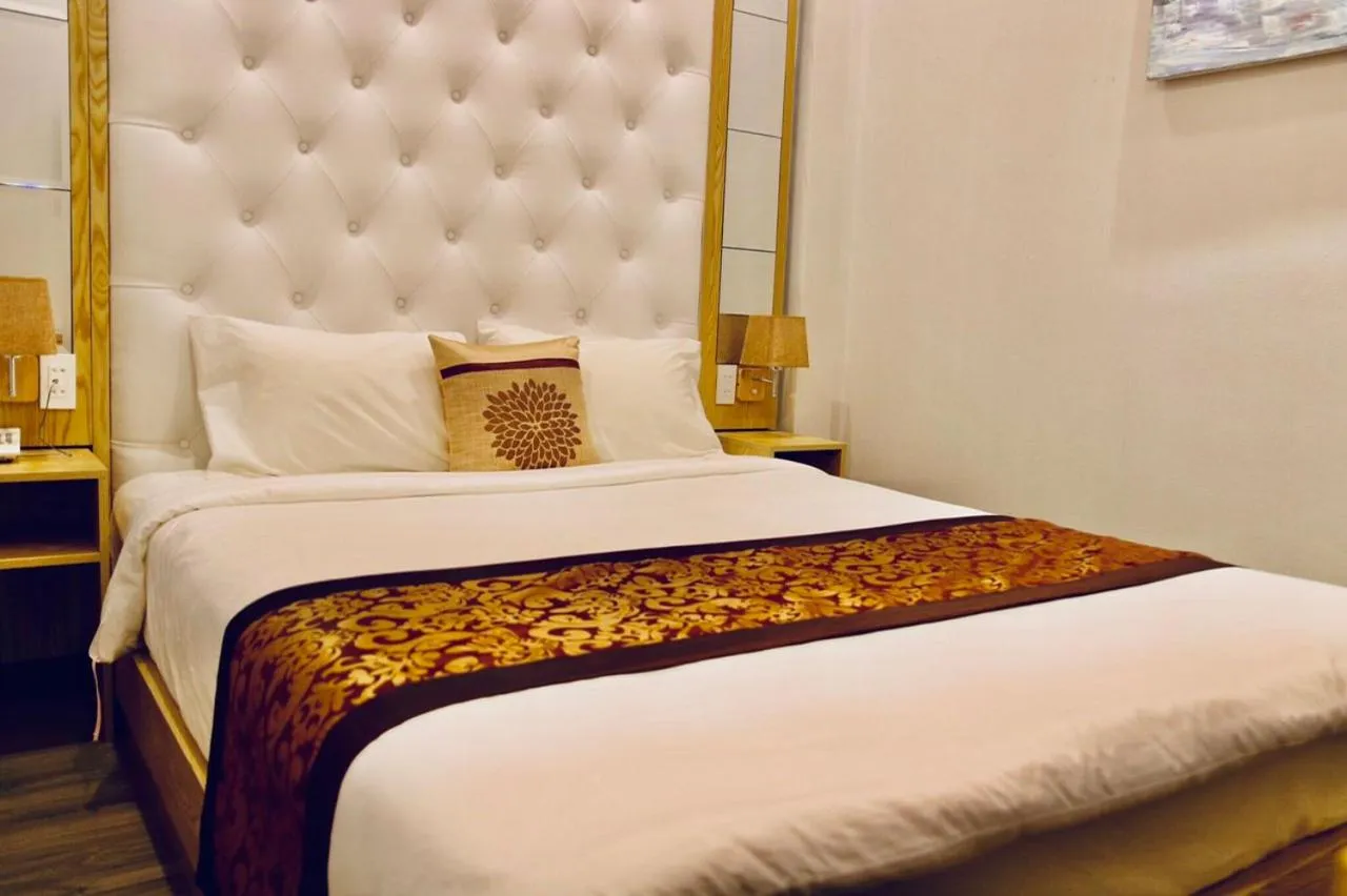 Bed in EMERALD OCEAN HOTEL