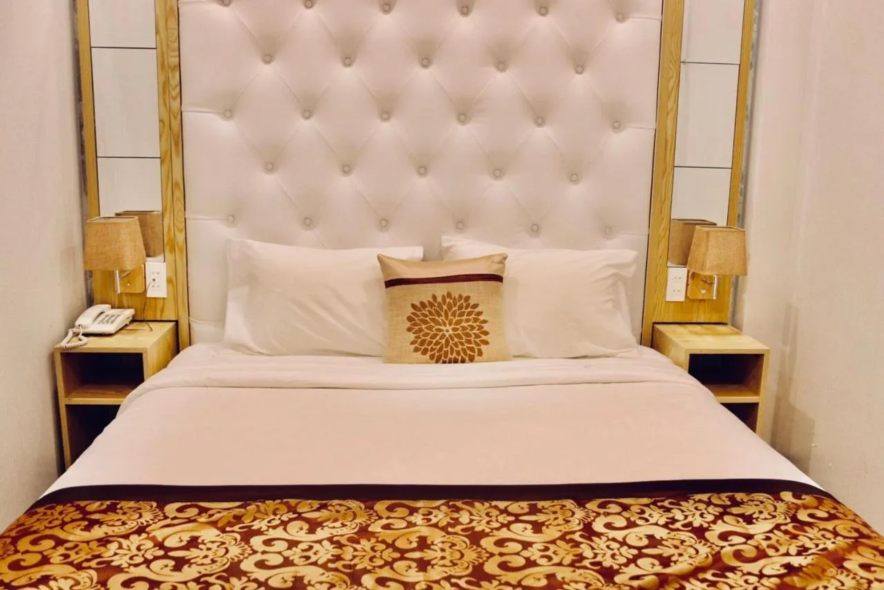 Bed in EMERALD OCEAN HOTEL