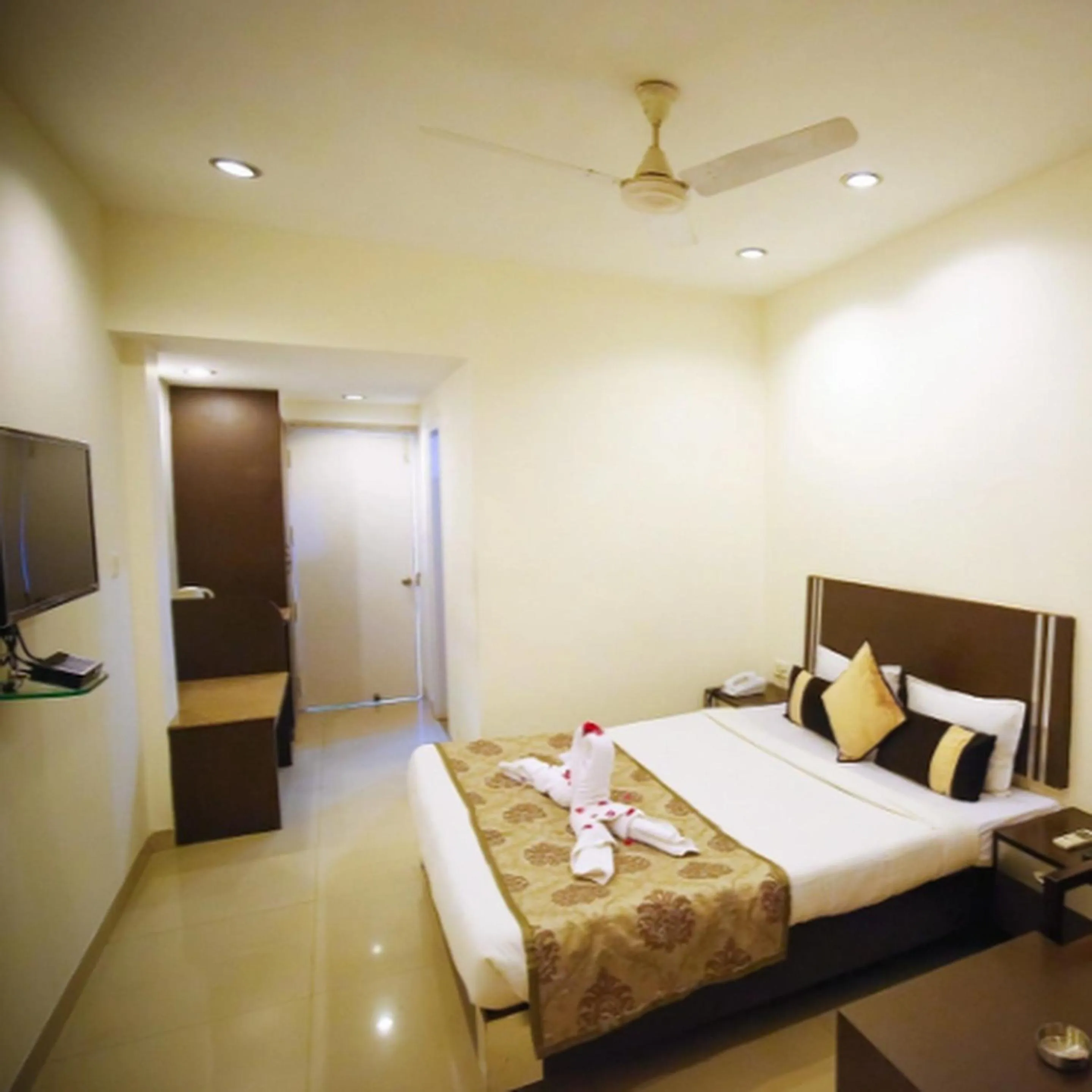 Bed in Regency Square Hotel