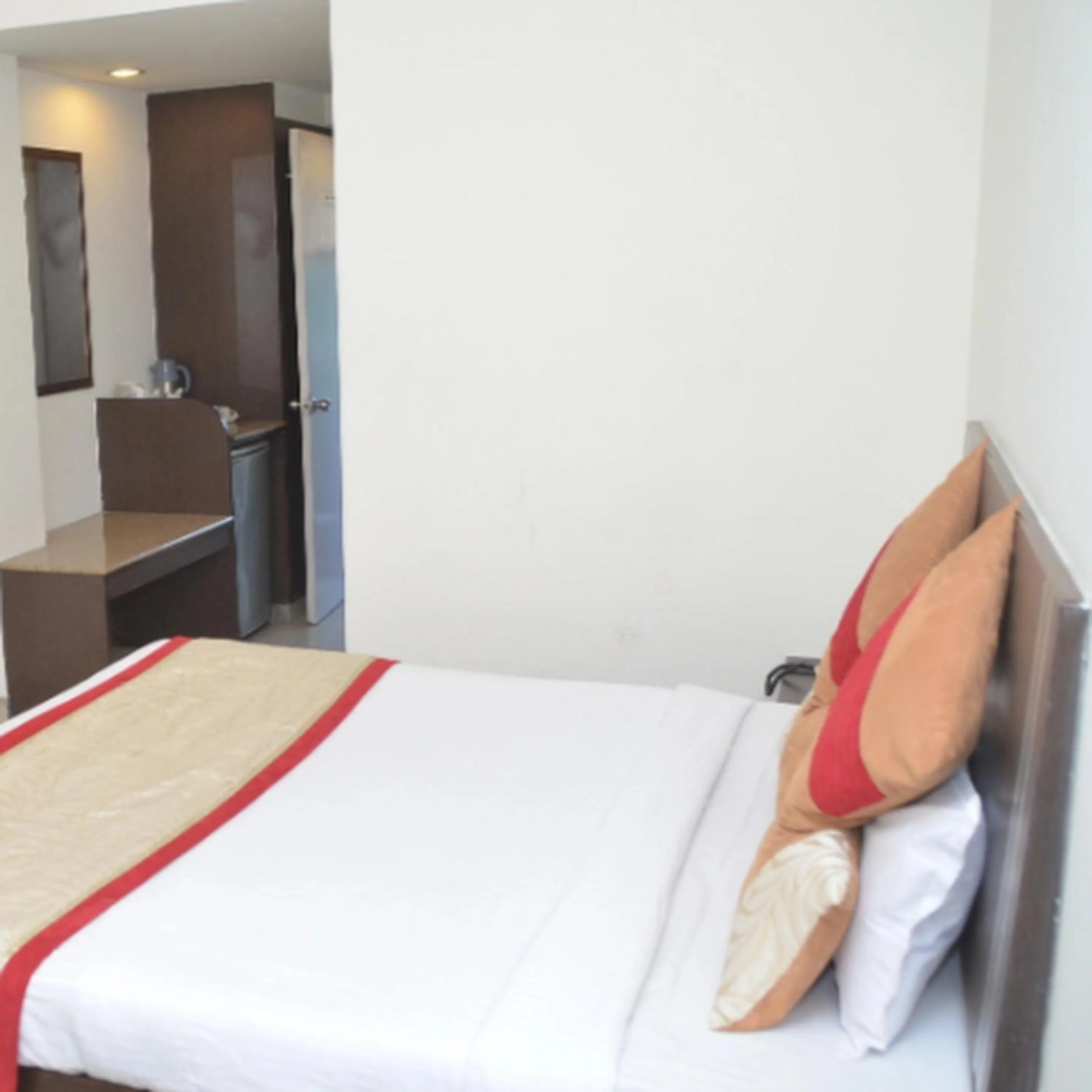 Bed in Regency Square Hotel