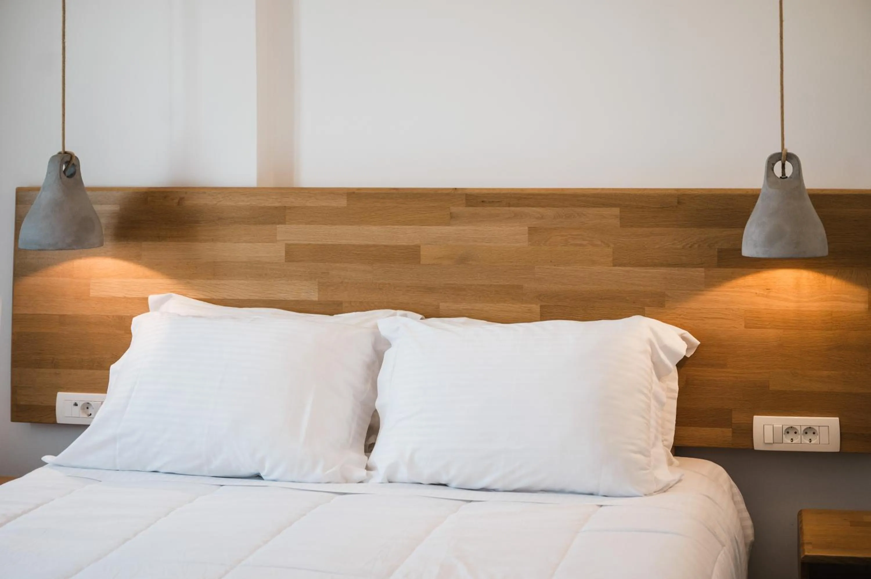 Bed in Amphitrite Suites Santorini