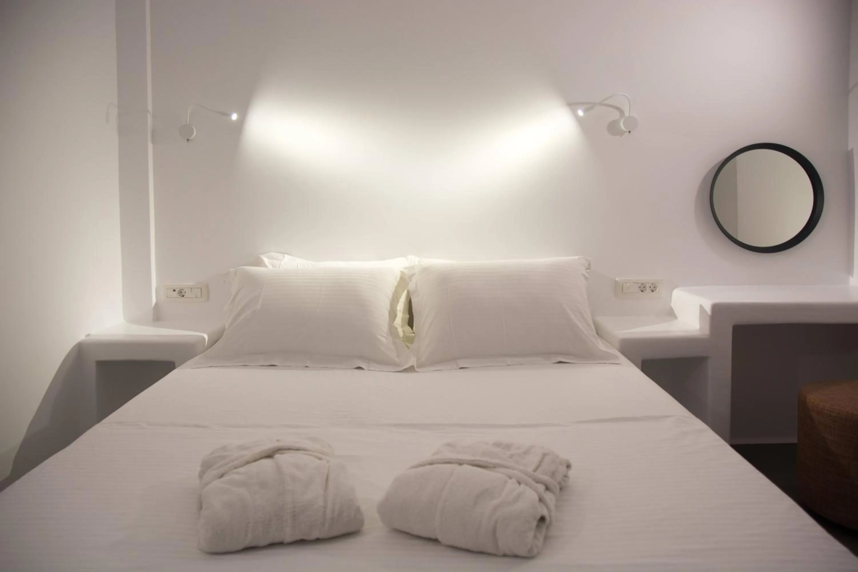 Bed in Amphitrite Suites Santorini