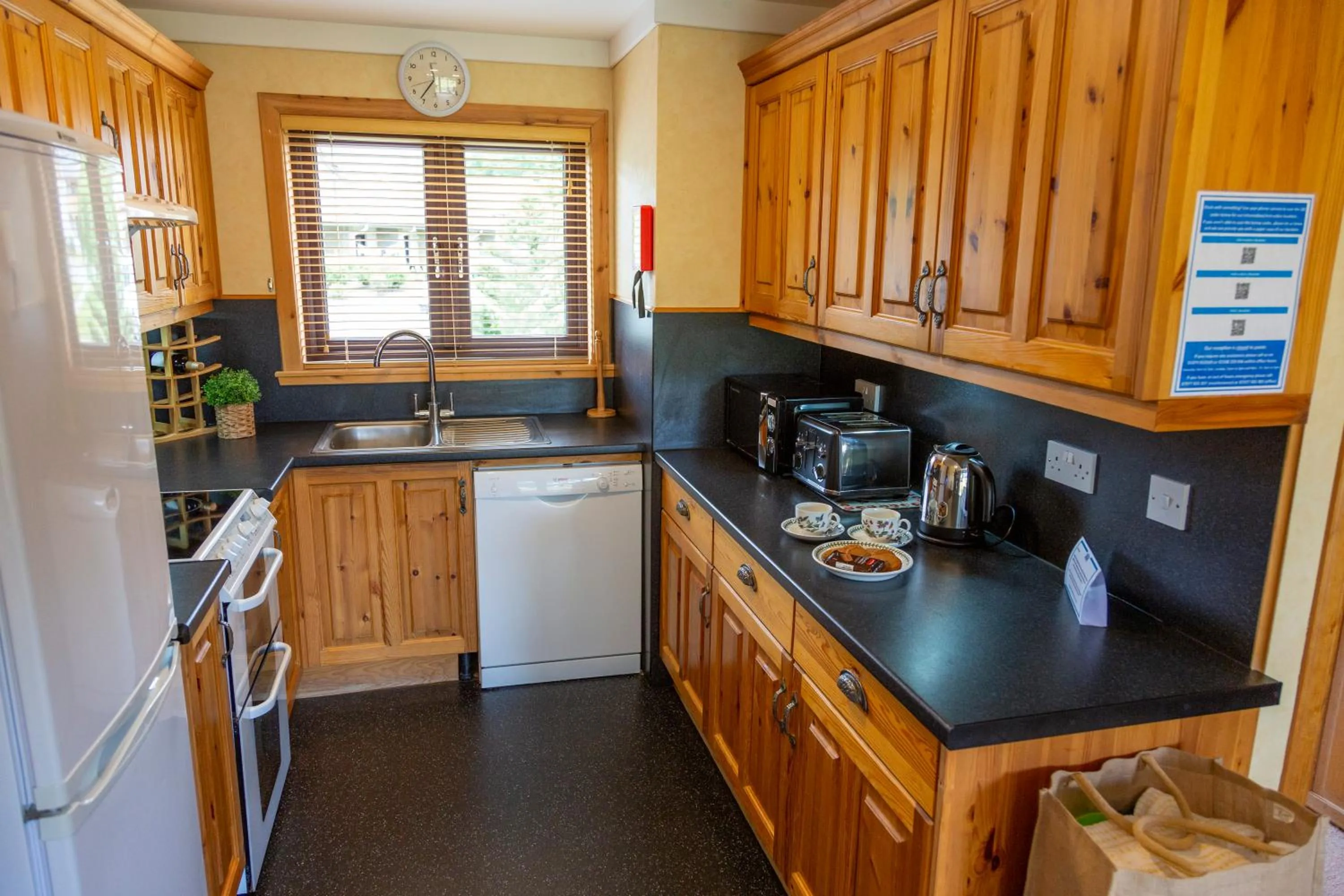 Kitchen or kitchenette in Scandinavian Village Ltd