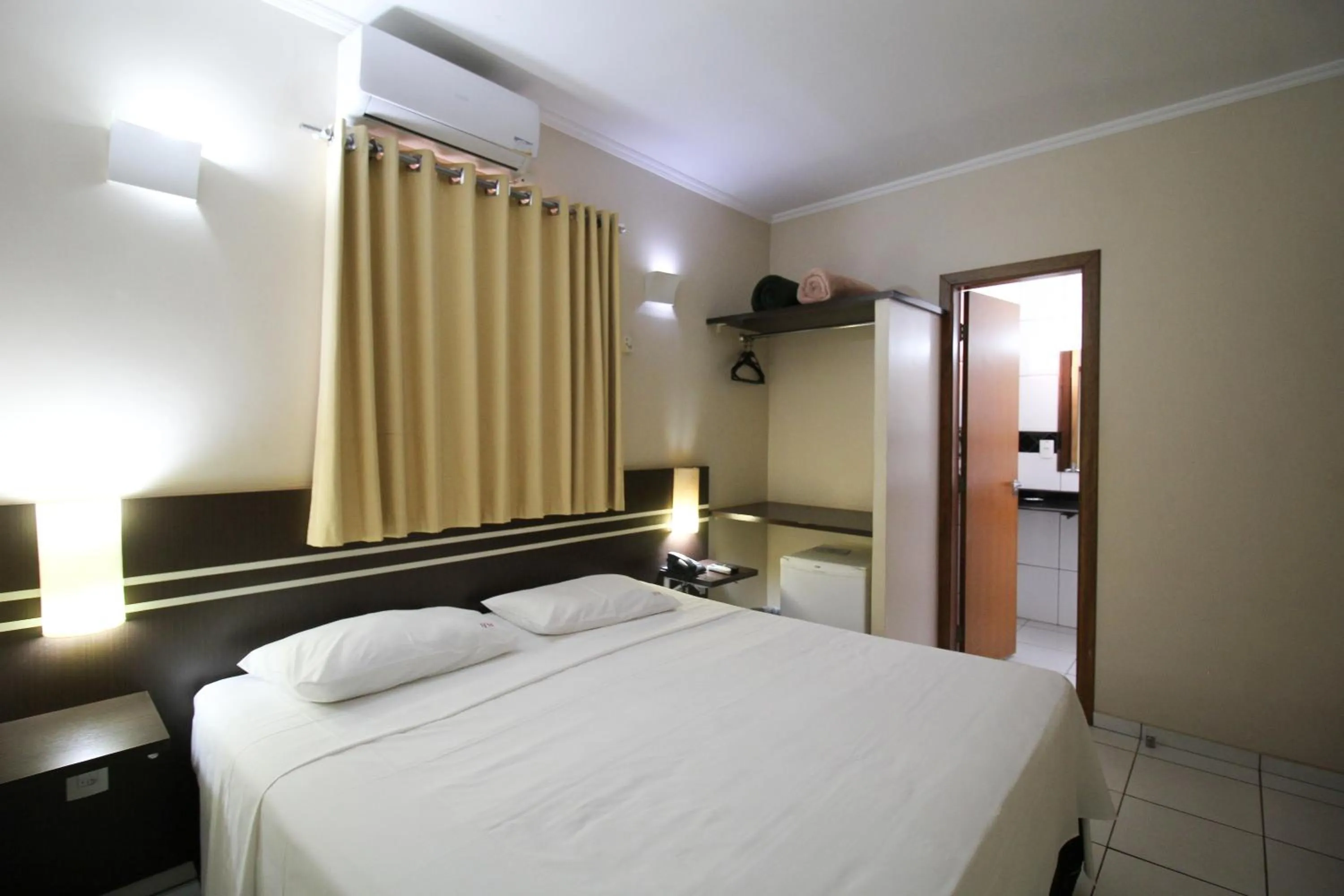 Bed in Pousada Água Eterna