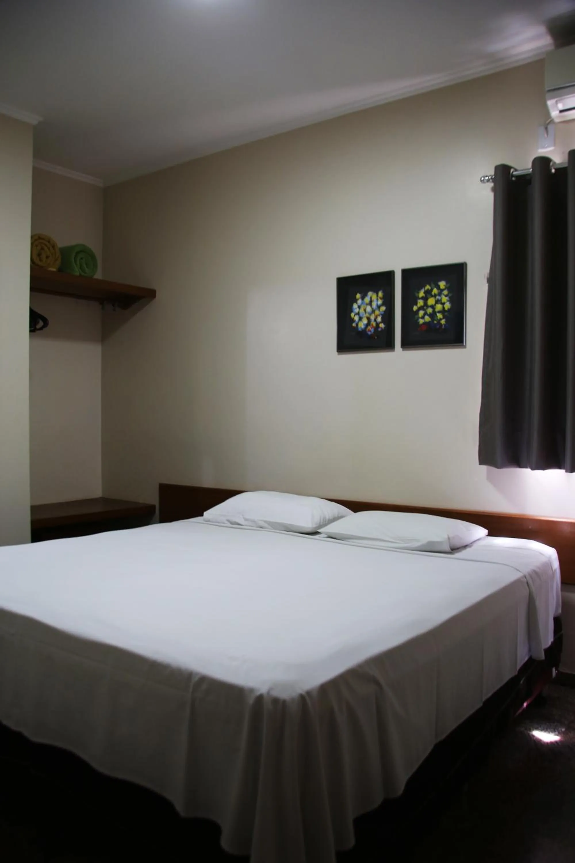 Bed in Pousada Água Eterna