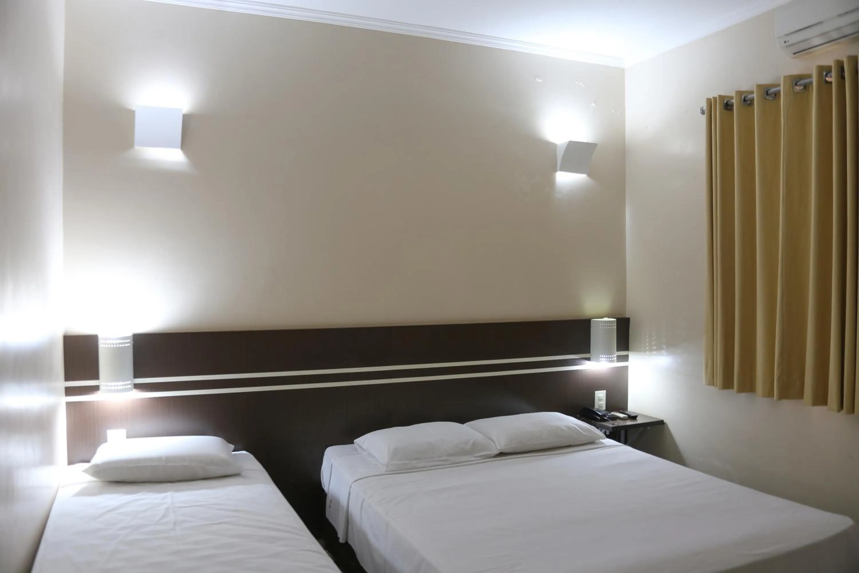 Bed in Pousada Água Eterna