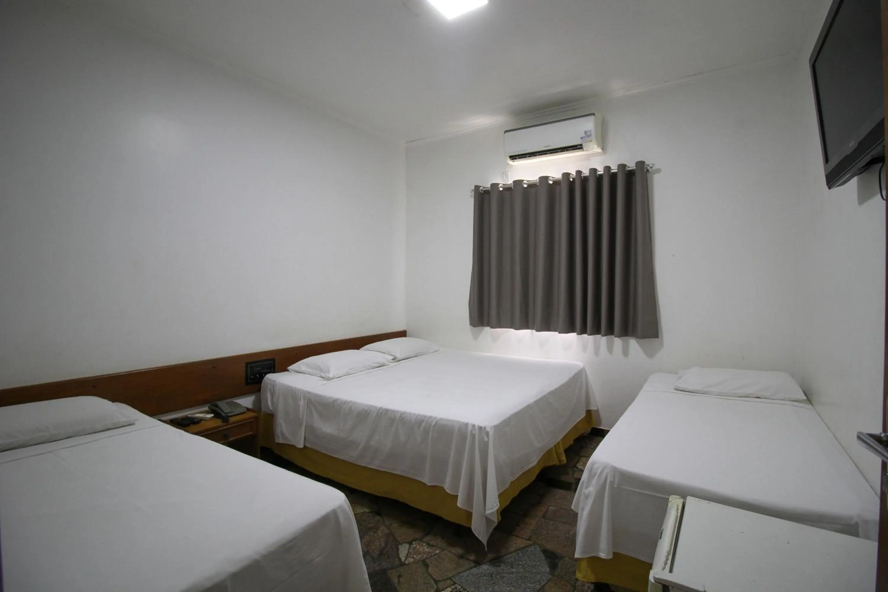 Bed in Pousada Água Eterna