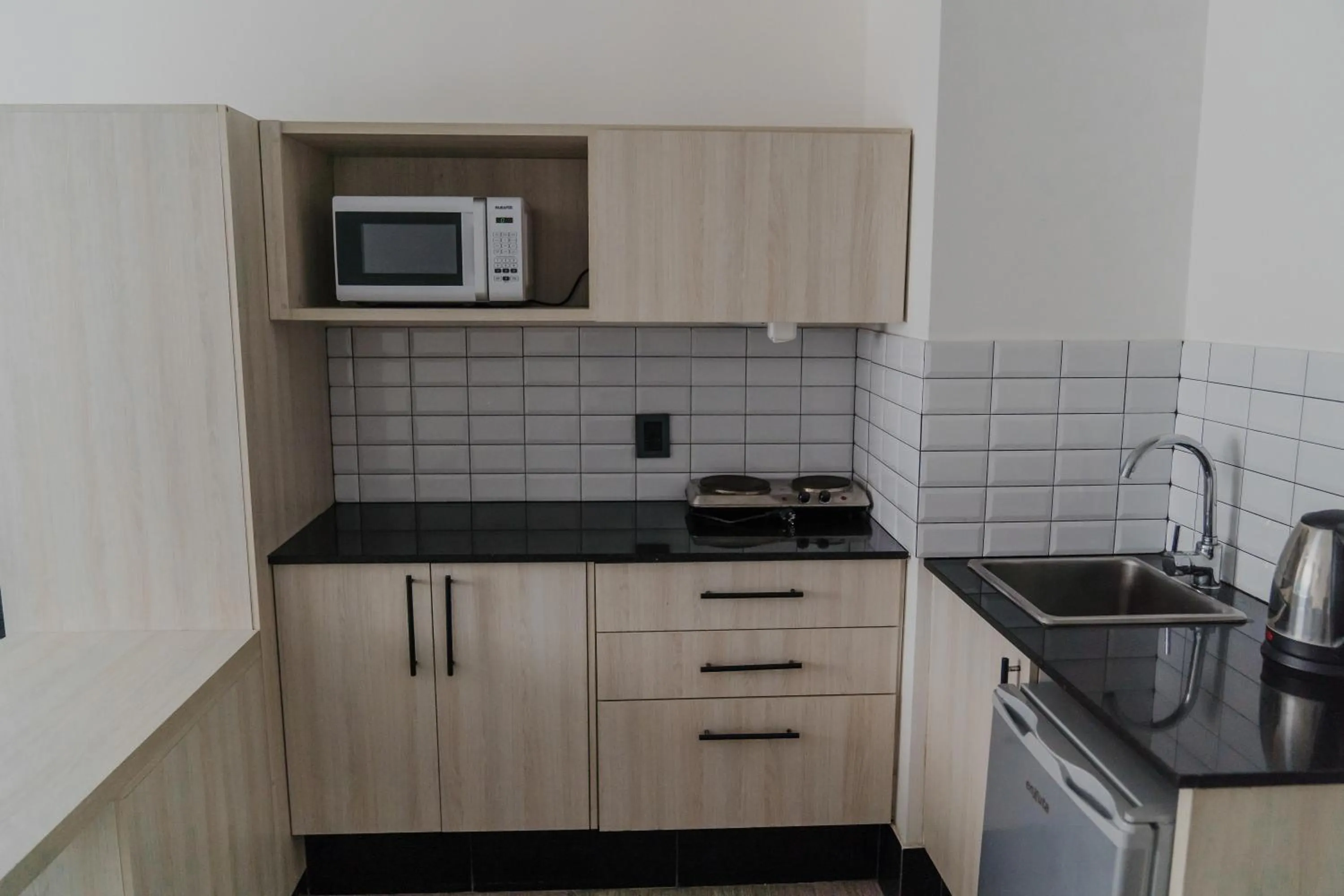 Kitchen or kitchenette in Quijano Hotel - Aparts & Suites