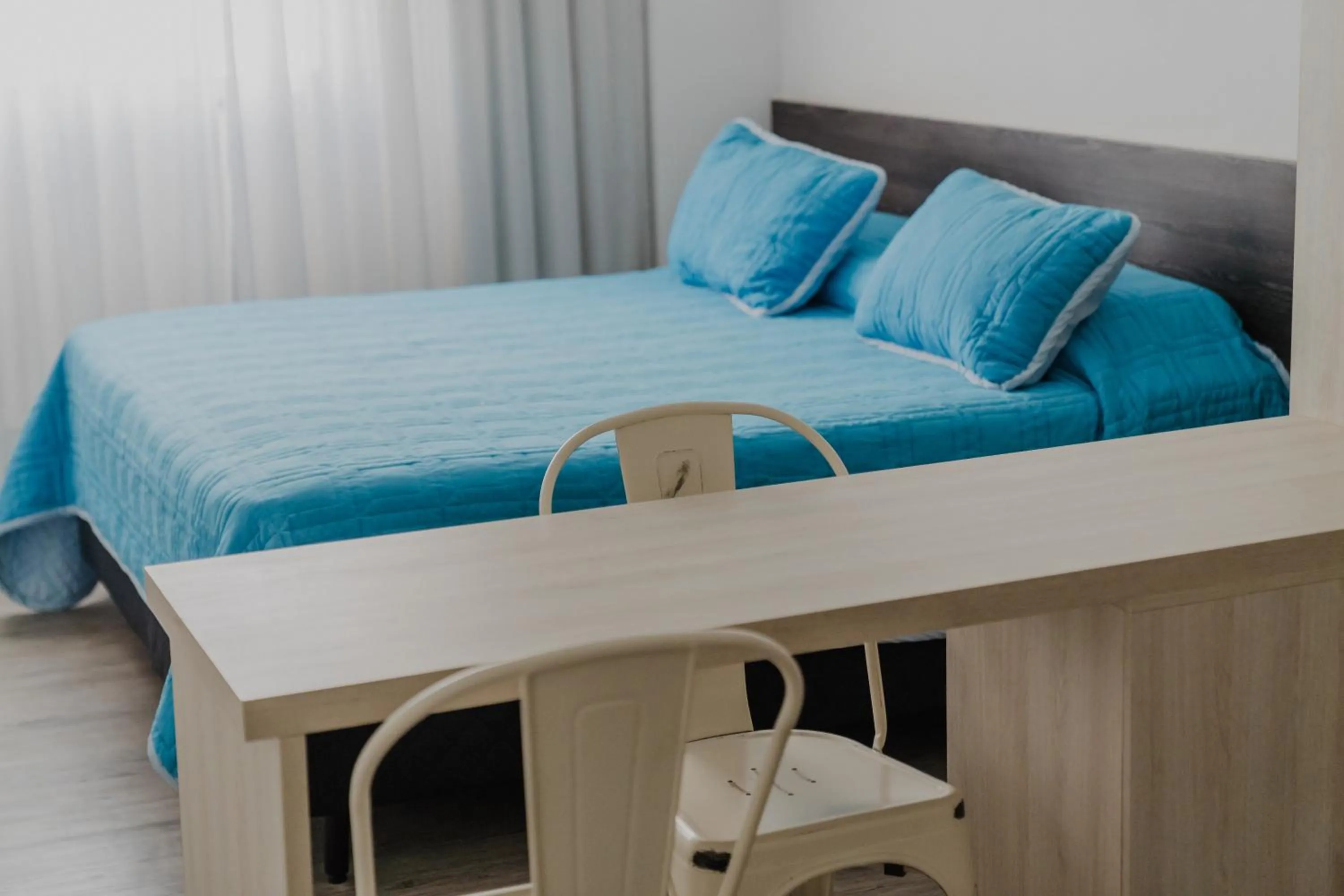 Photo of the whole room, Bed in Quijano Hotel - Aparts & Suites