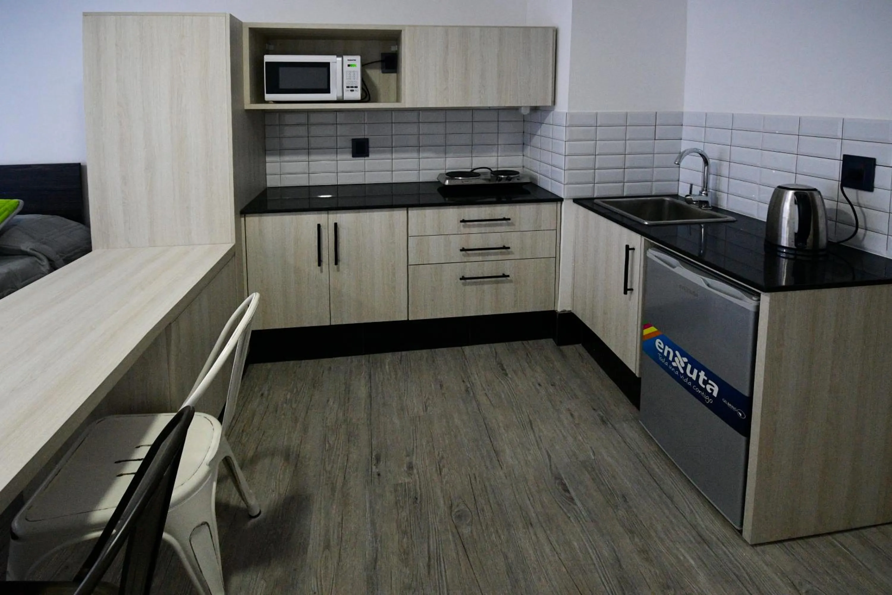 Kitchen or kitchenette in Quijano Hotel - Aparts & Suites