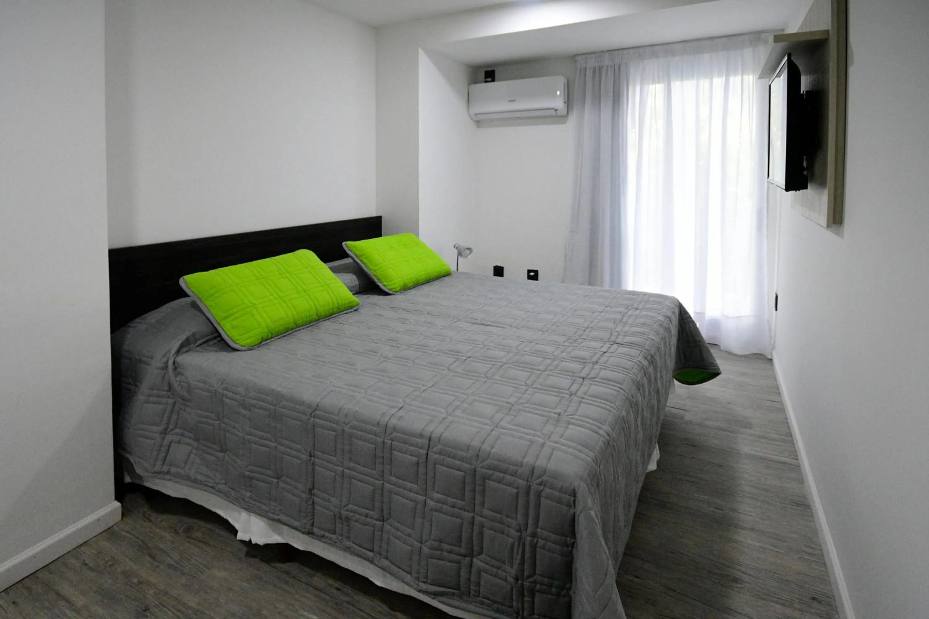 Bed in Quijano Hotel - Aparts & Suites