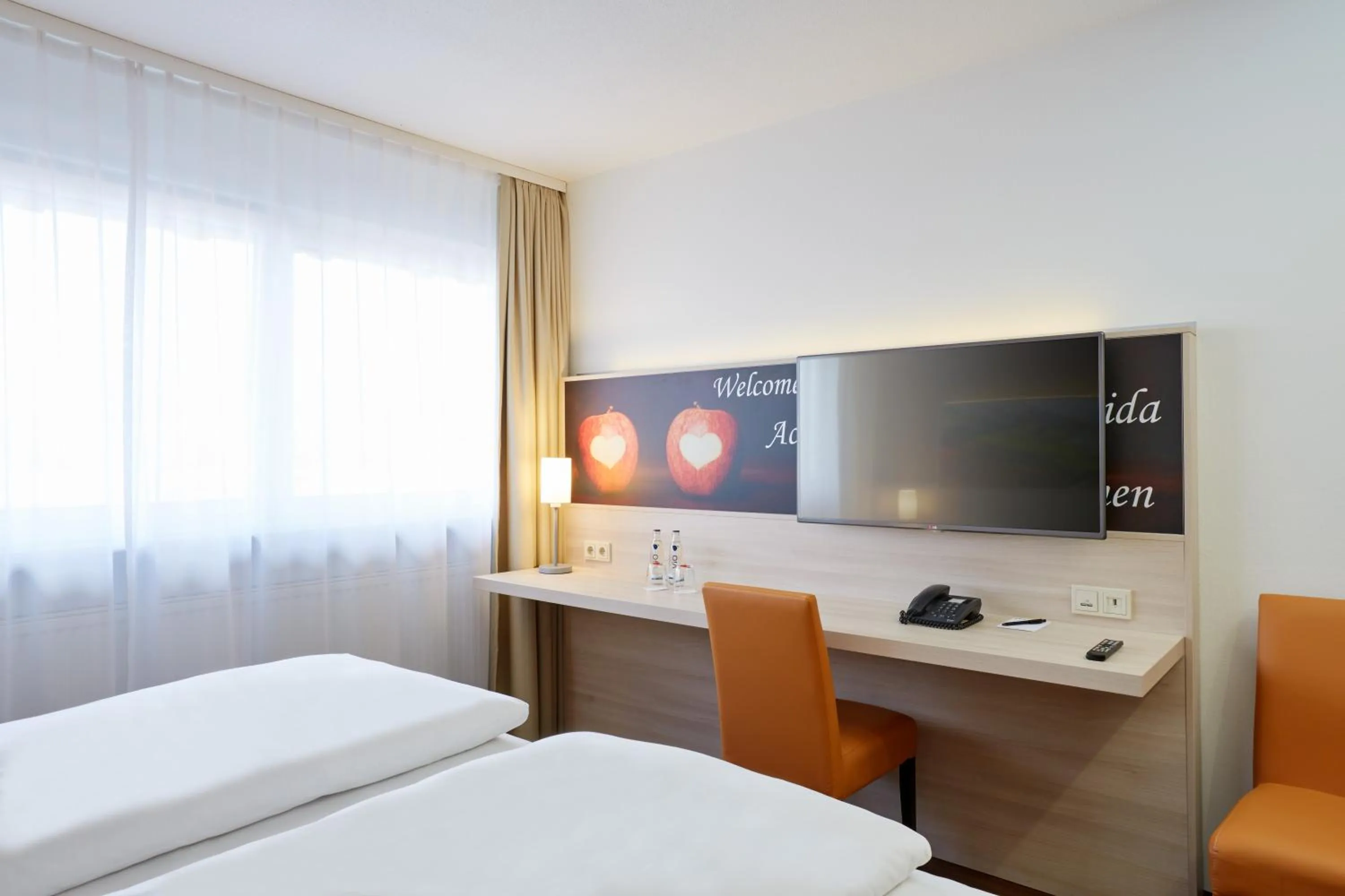 Photo of the whole room, Bed in H+ Hotel Stuttgart Herrenberg