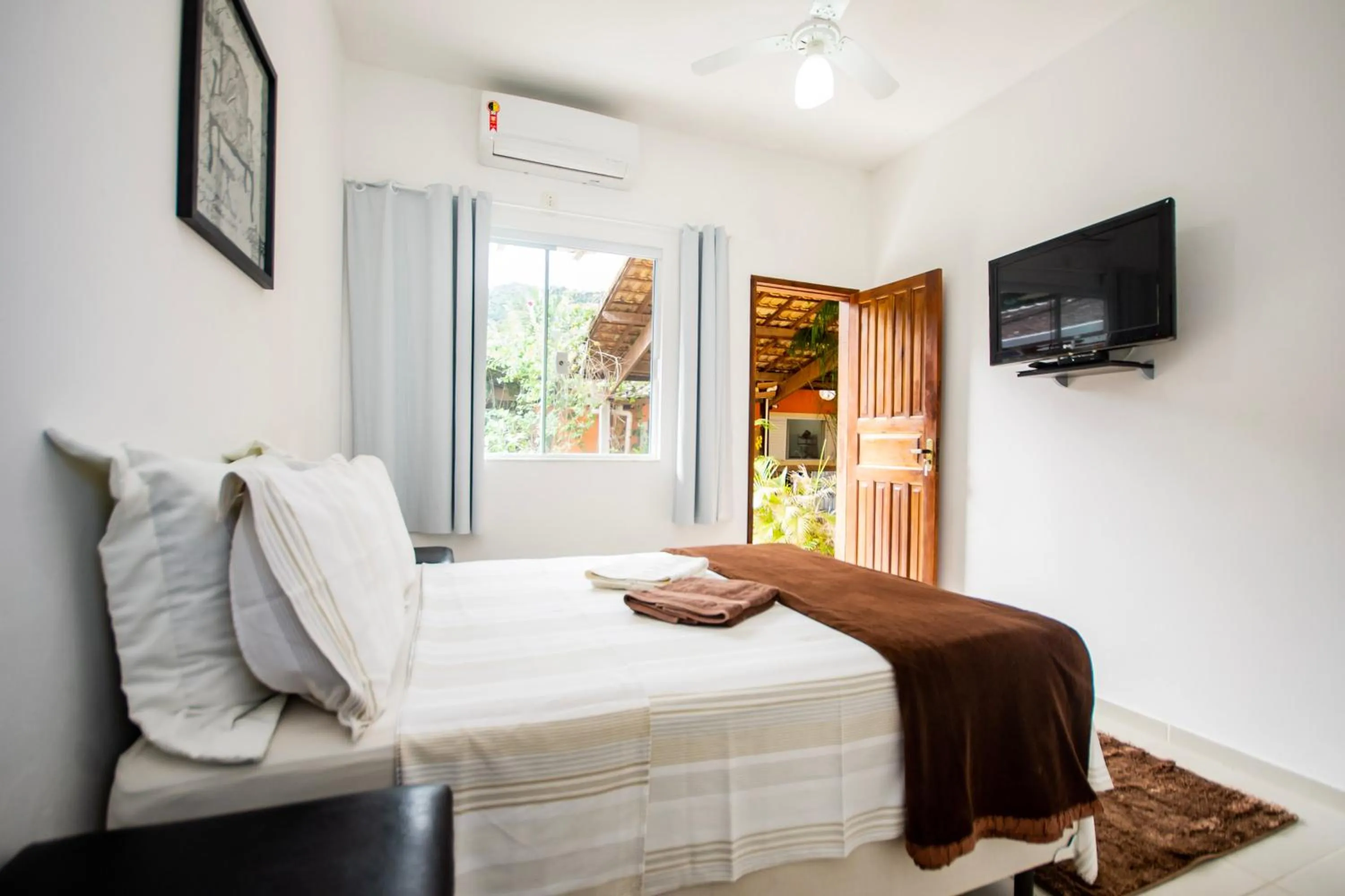 Bed in Pousada Quatro Estações Paraty