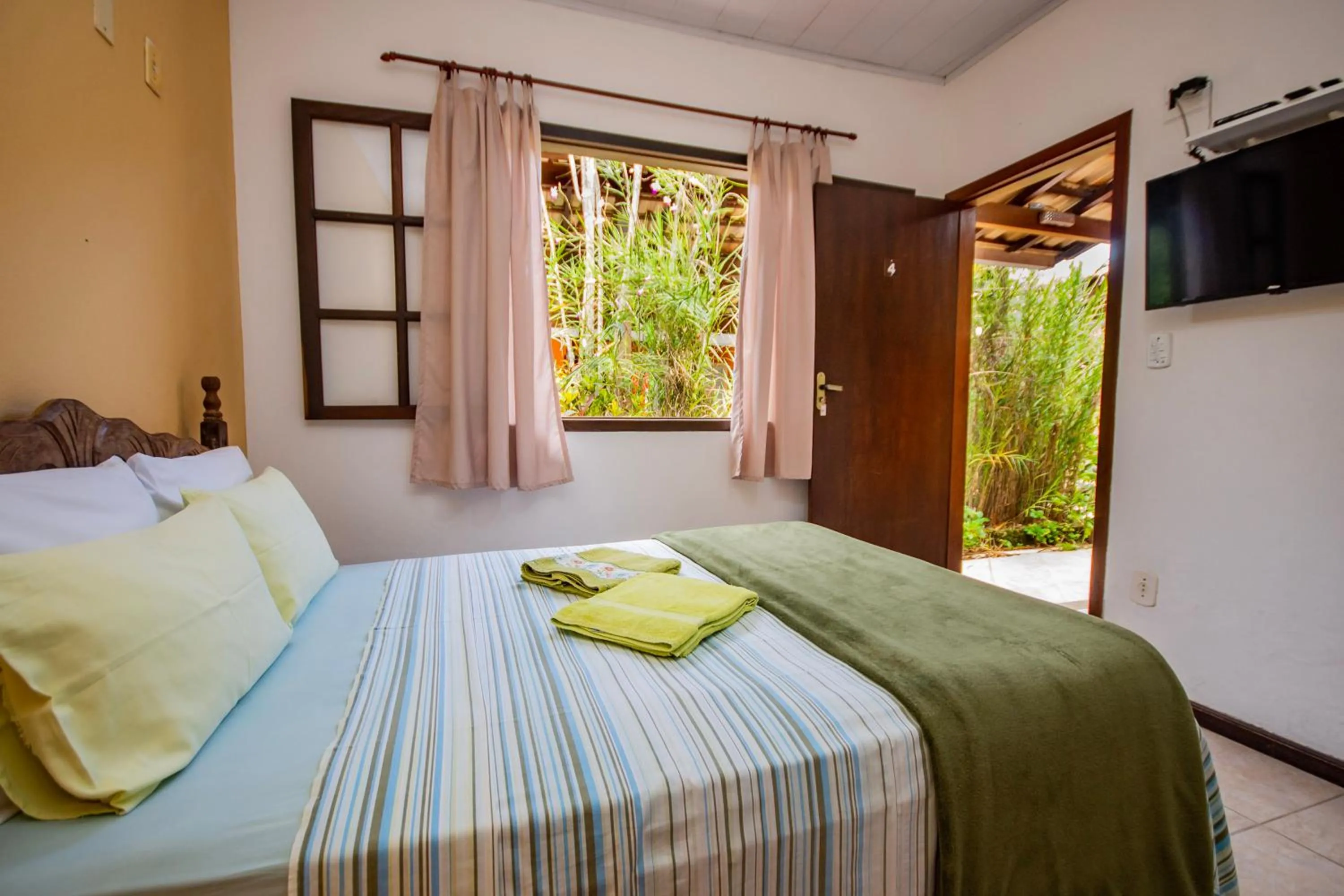 Bed in Pousada Quatro Estações Paraty